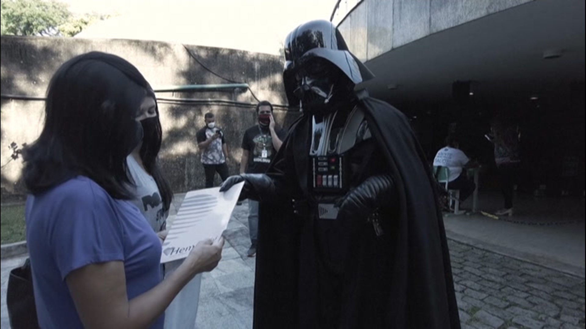 An actor dressed as Darth Vader encouraged and congratulated people waiting in line for their COVID-19 vaccination in Rio De Janeiro, Brazil, for Star Wars Day, May 4.