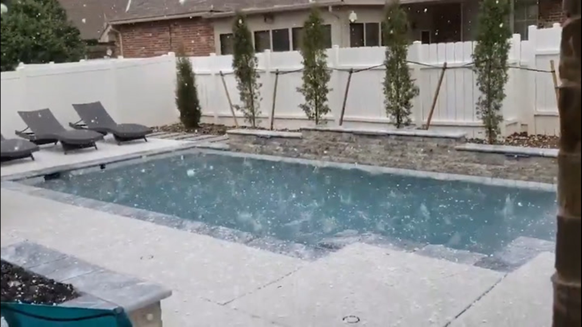 Severe storms dumped hail on Edmond, Oklahoma, on March 27. The hail pelted this backyard and pool.