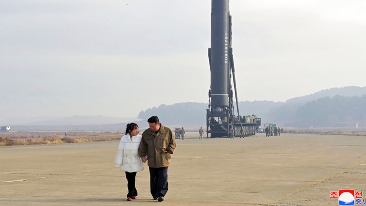 North Korea unveils Kim's daughter at missile launch site