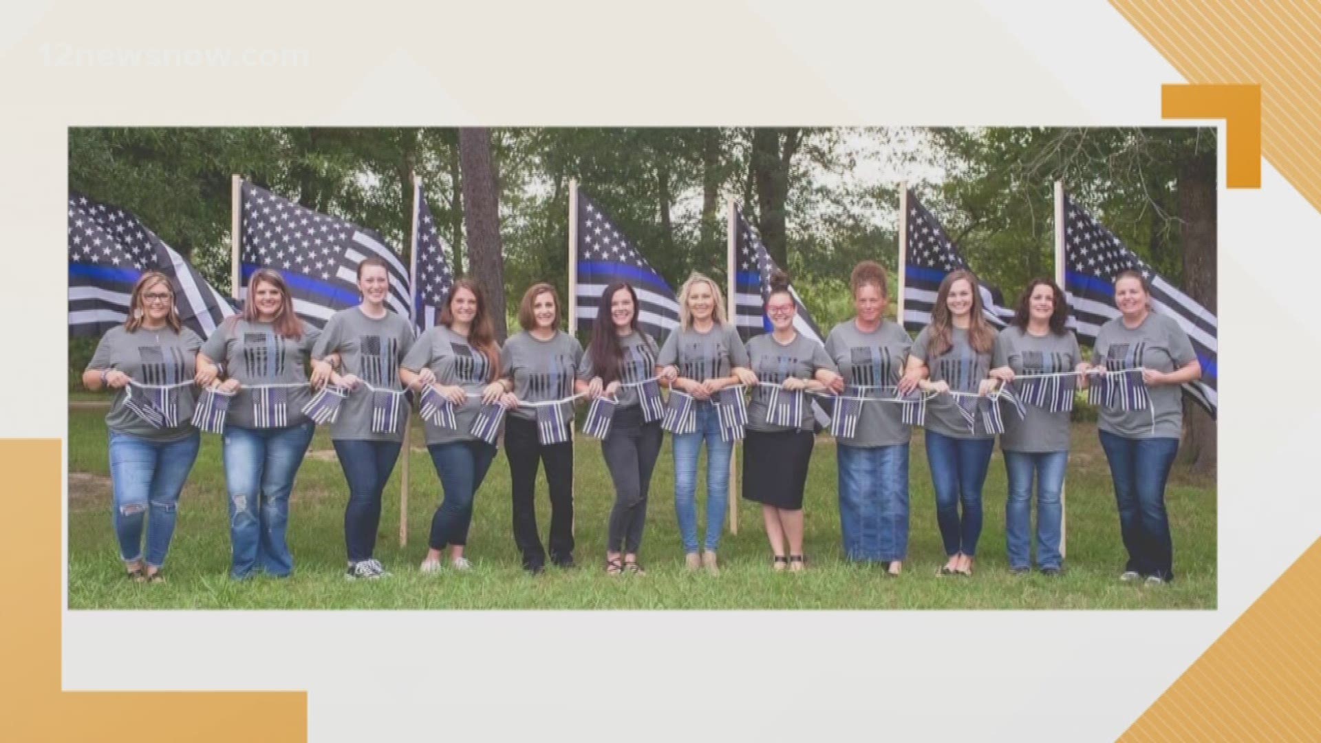 The Lumberton Police officers' wives stood in a line of unity to support their husbands, all holding American flags with the thin blue line.