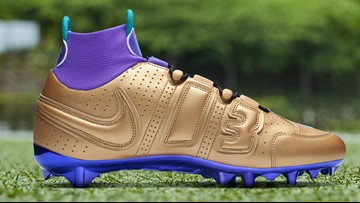 purple and gold football cleats