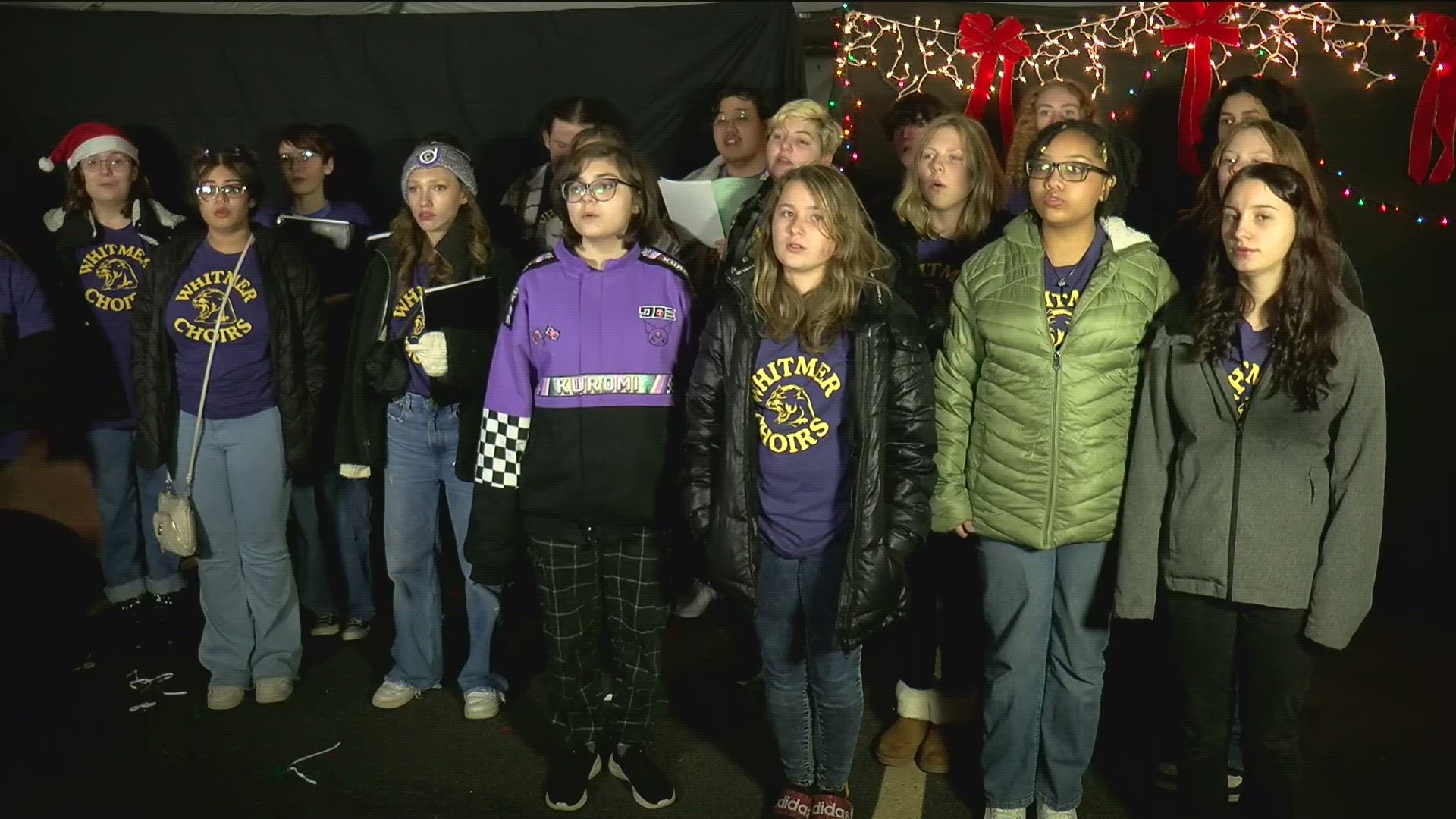 The Whitmer High School choirs entertained the crowds at Thursday's toy drive event.