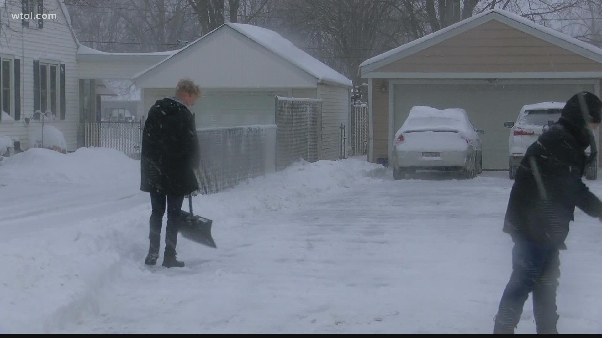 Shoveling driveways to help others. Jarrett Jones and Spencer Olson clearing 15 houses in Adrian.