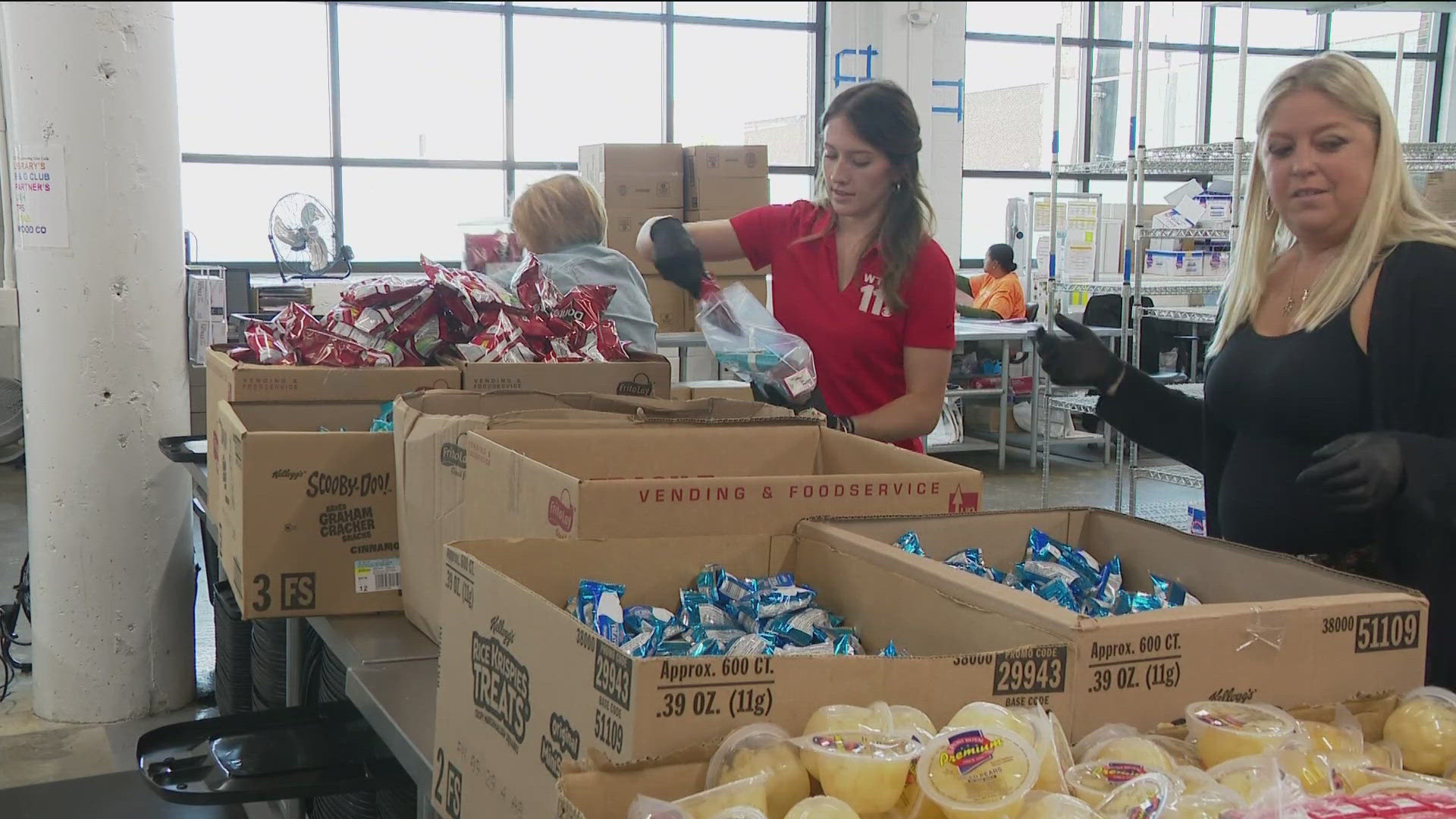 WTOL 11 employees volunteered Wednesday to pack weekend snack bags for kids to take home at the end of the week.