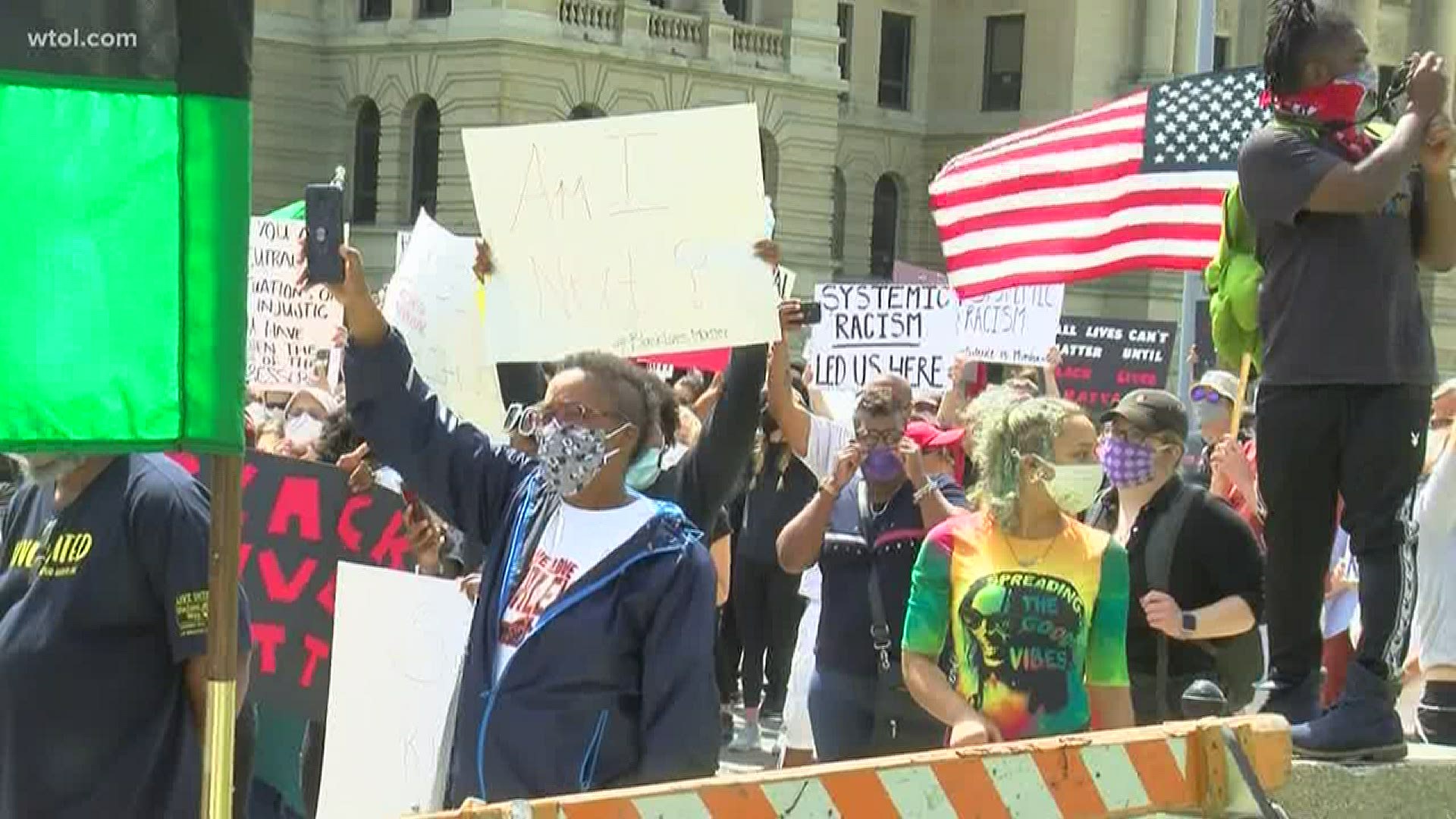 Hundreds of people gathered in downtown Toledo on Saturday afternoon for rally to demand justice for George Floyd, who died while in police custody Monday.