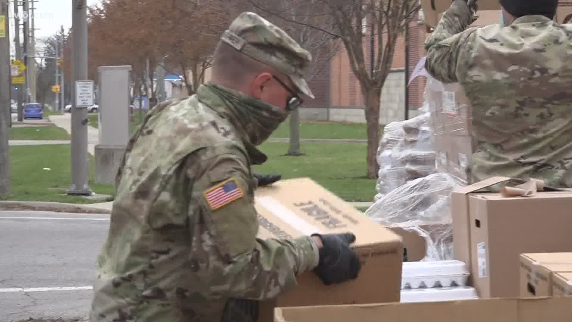 The line outside the James Caldwell Community Center stretched more than a half-mile Thursday as members of the Ohio National Guard filled hundreds of cars with food