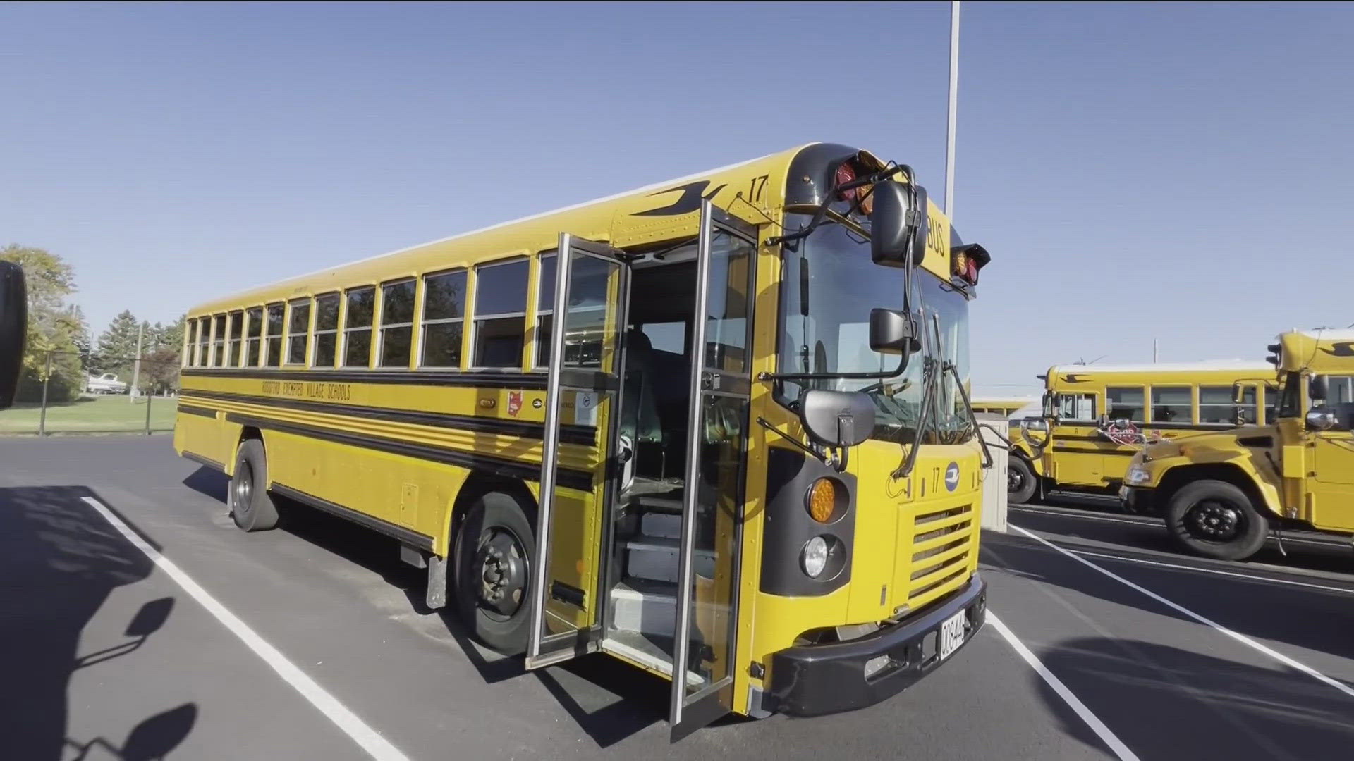 Maya May chats with law enforcement about the importance of obeying school bus safety laws.