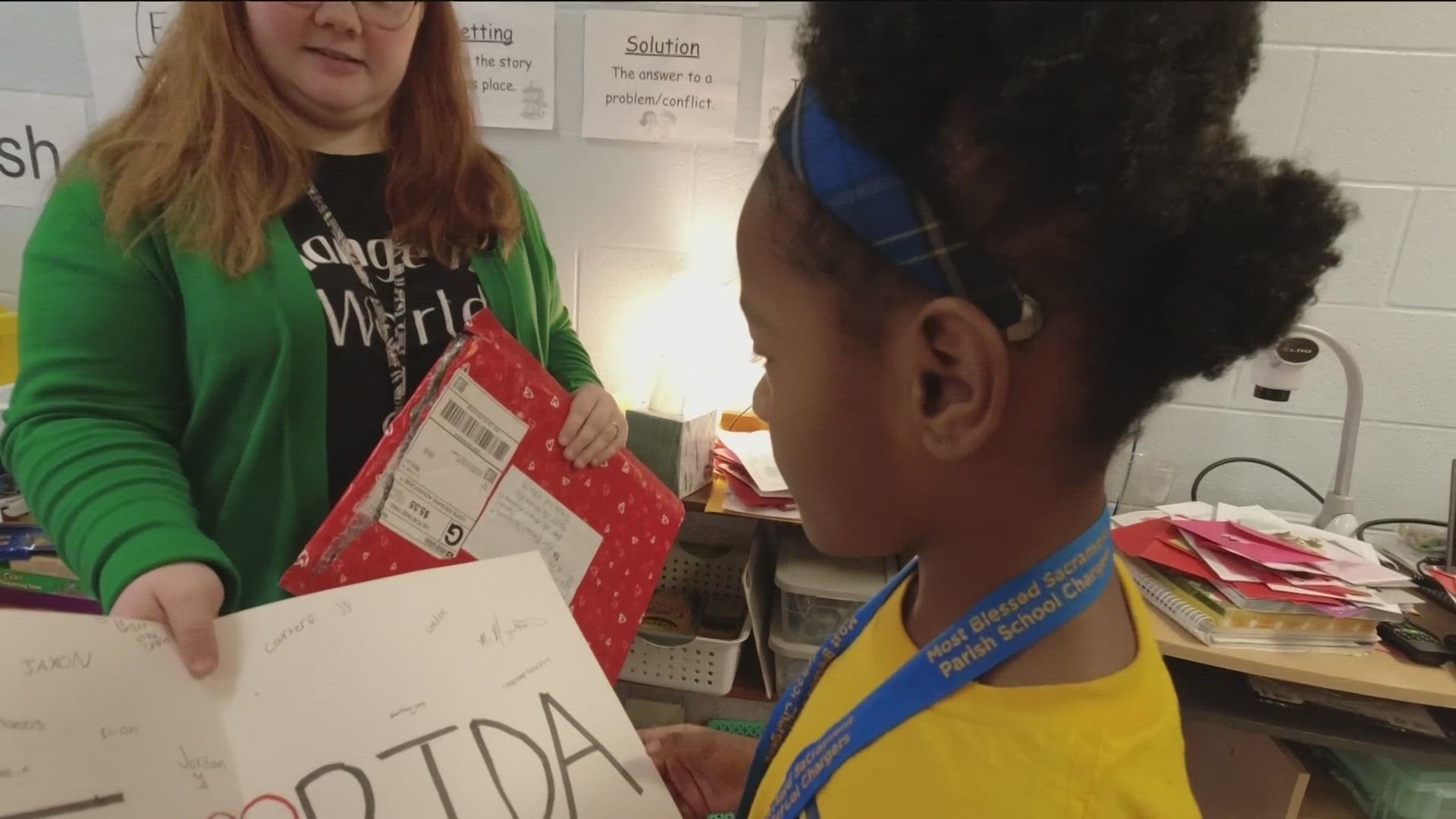 Ms. Kuhlman's second grade class learns about the world beyond Toledo with Valentine's Day cards from the U.S. and beyond.