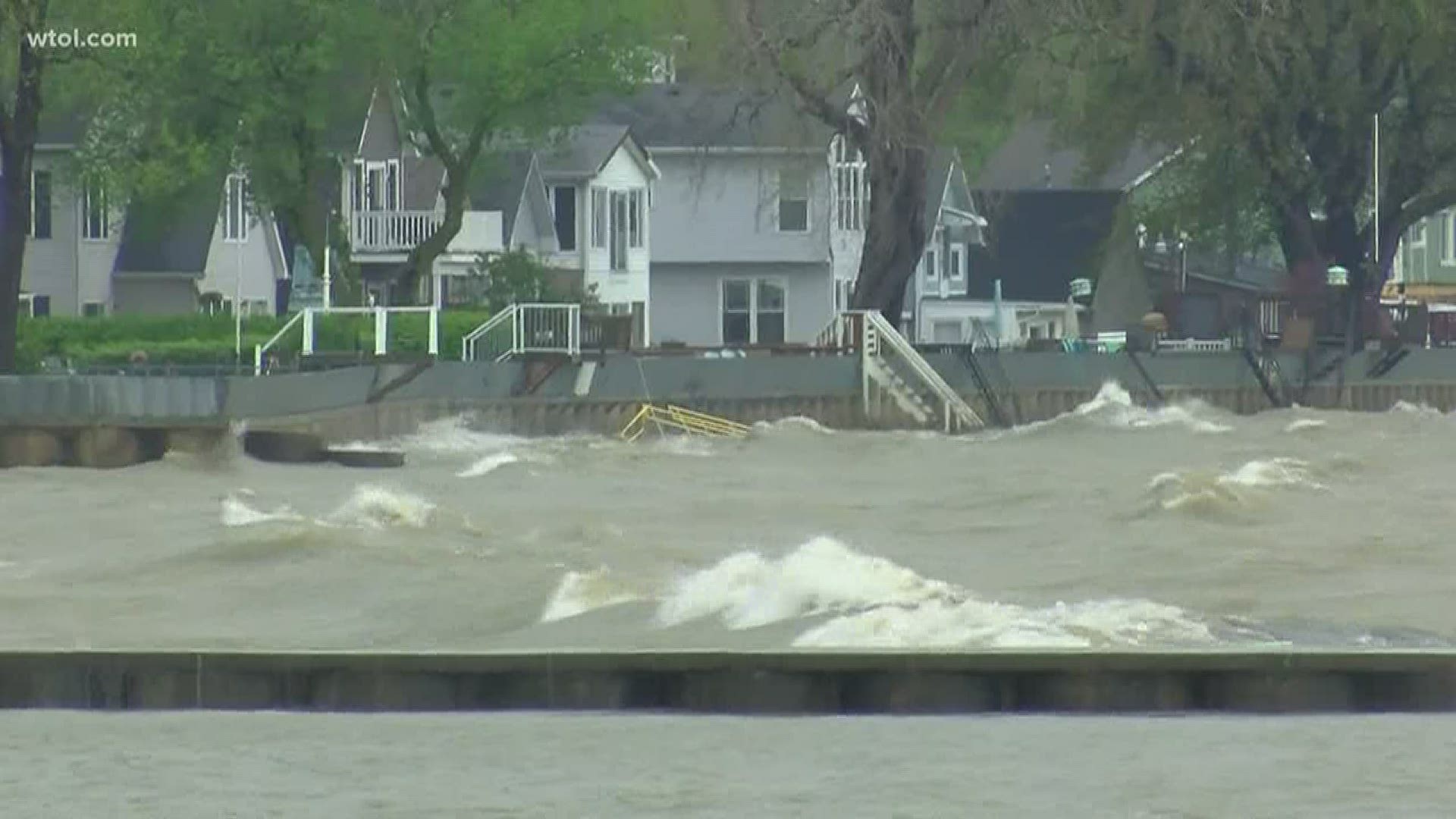 Record high water levels at Lake Erie, paired with strong winds, splashed gallons of water over the seawall.