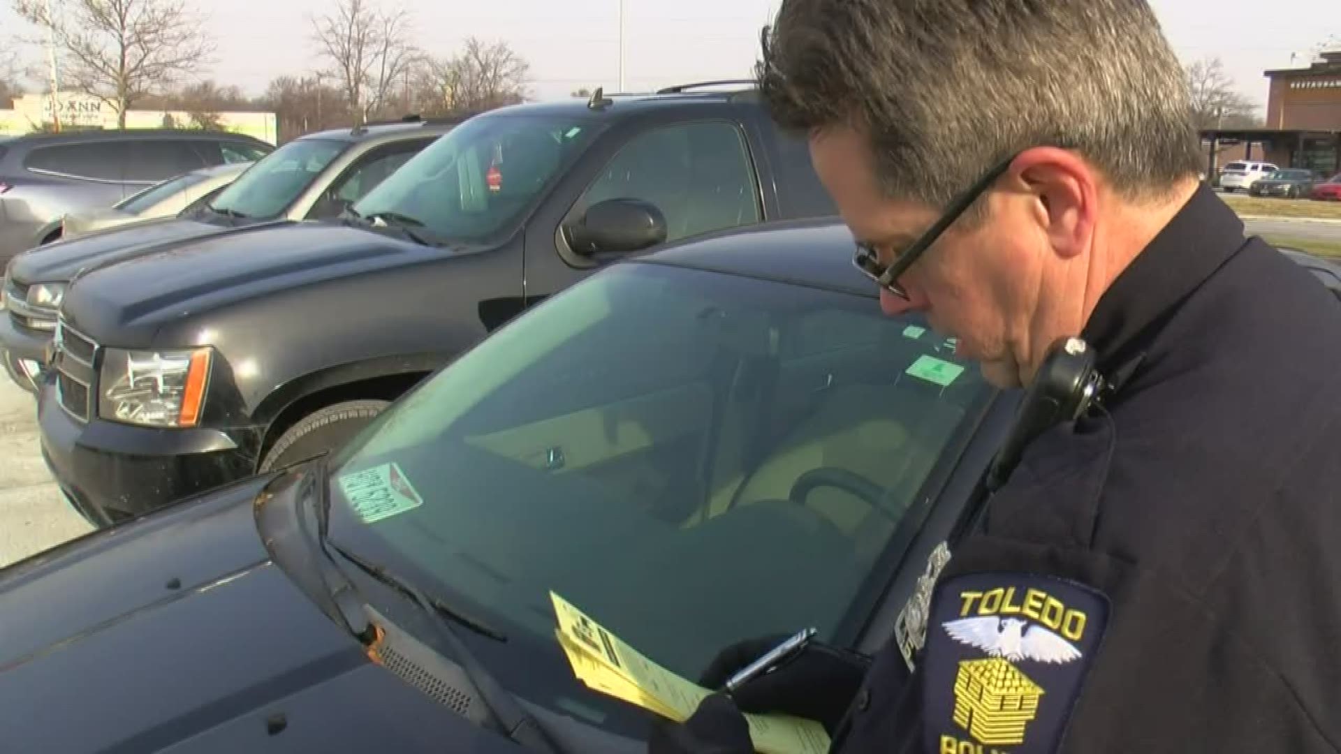 Toledo police are issuing vehicle report cards to educate drivers about leaving enticing items out in the open.