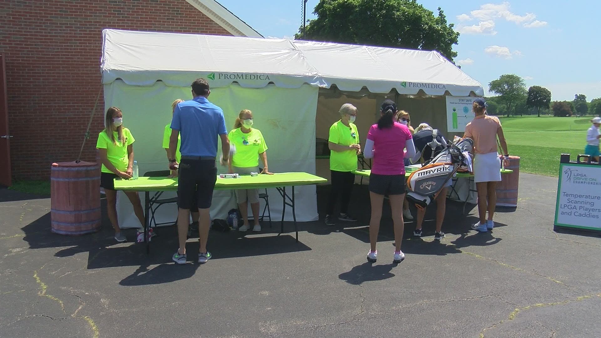 As players arrive at Inverness they are greeted by temperature checks. They are also met by an Eastwood grad who works full-time on the LPGA tour.