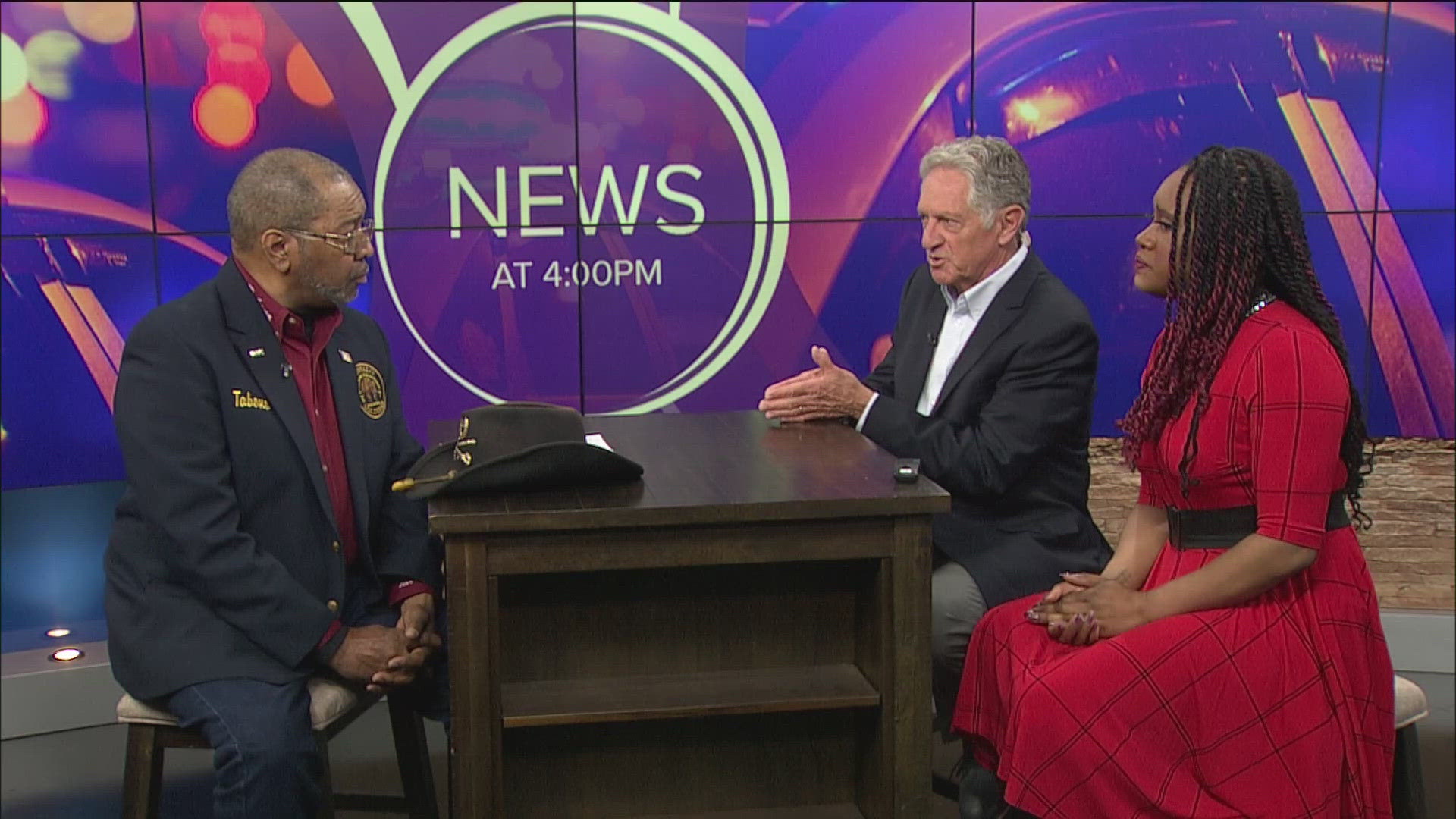Earl Mack, a retired police officer, talks with TaTiana Cash and Dan Cummins about the recent in-custody death of Frank E. Tyson in East Canton.
