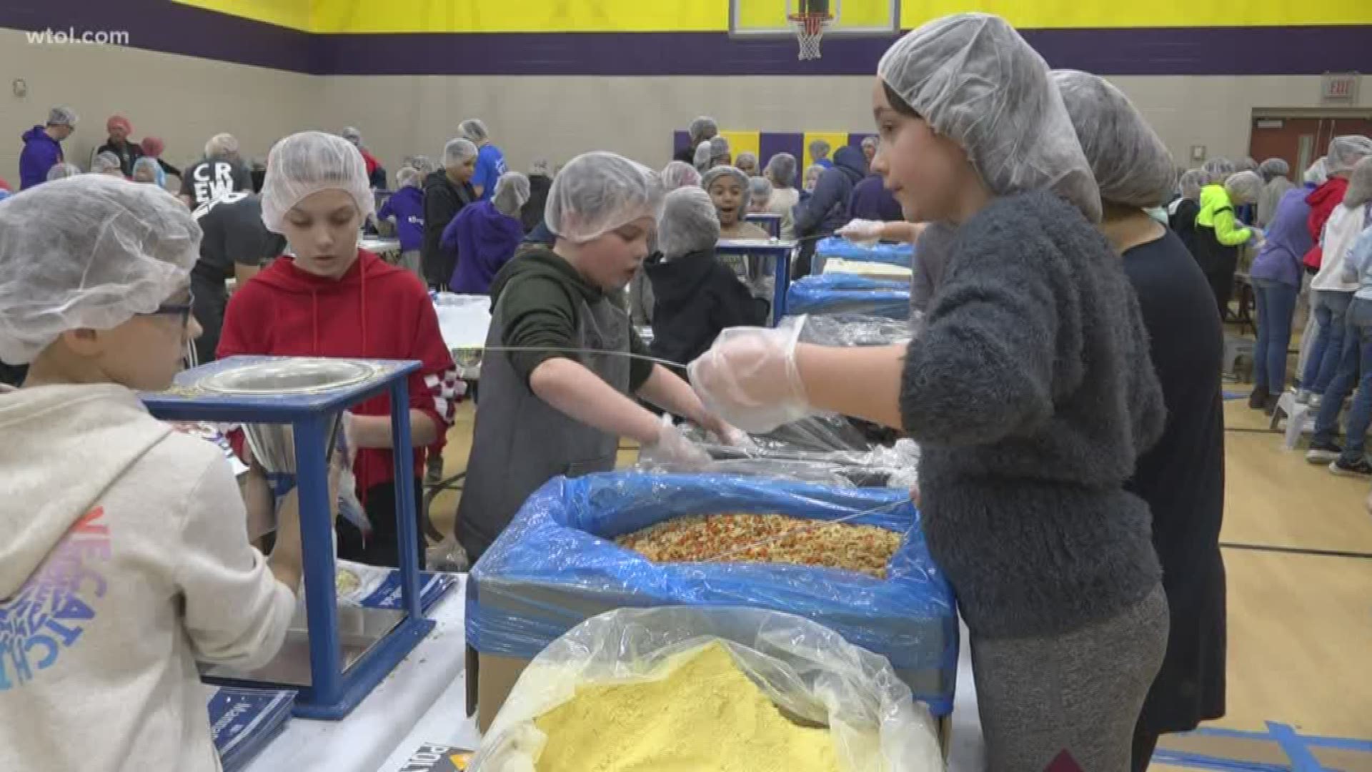 Students at Wayne Trail Elementary School, taking a break from the usual learning, to pack thousands of meals for starving children