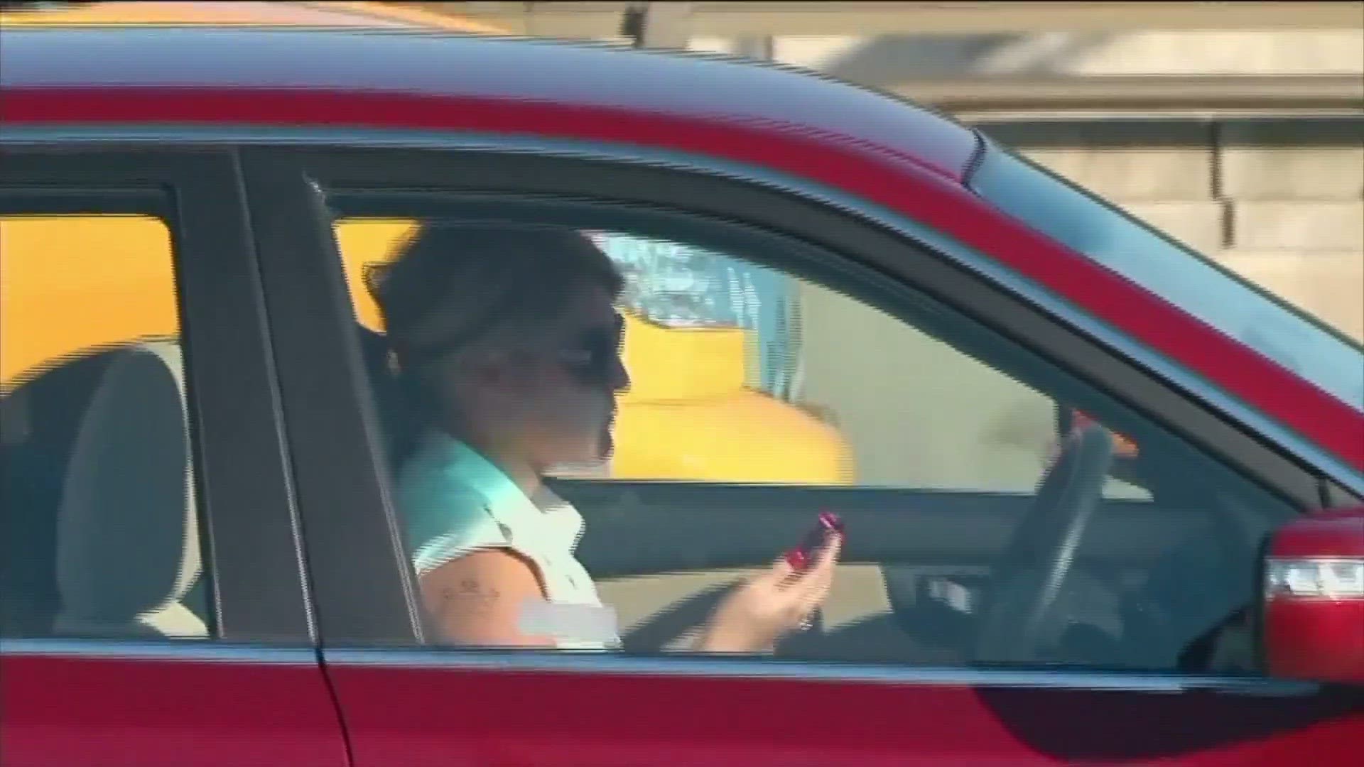 The new law prohibits having your phone in your hand while in the vehicle, even at stop lights.