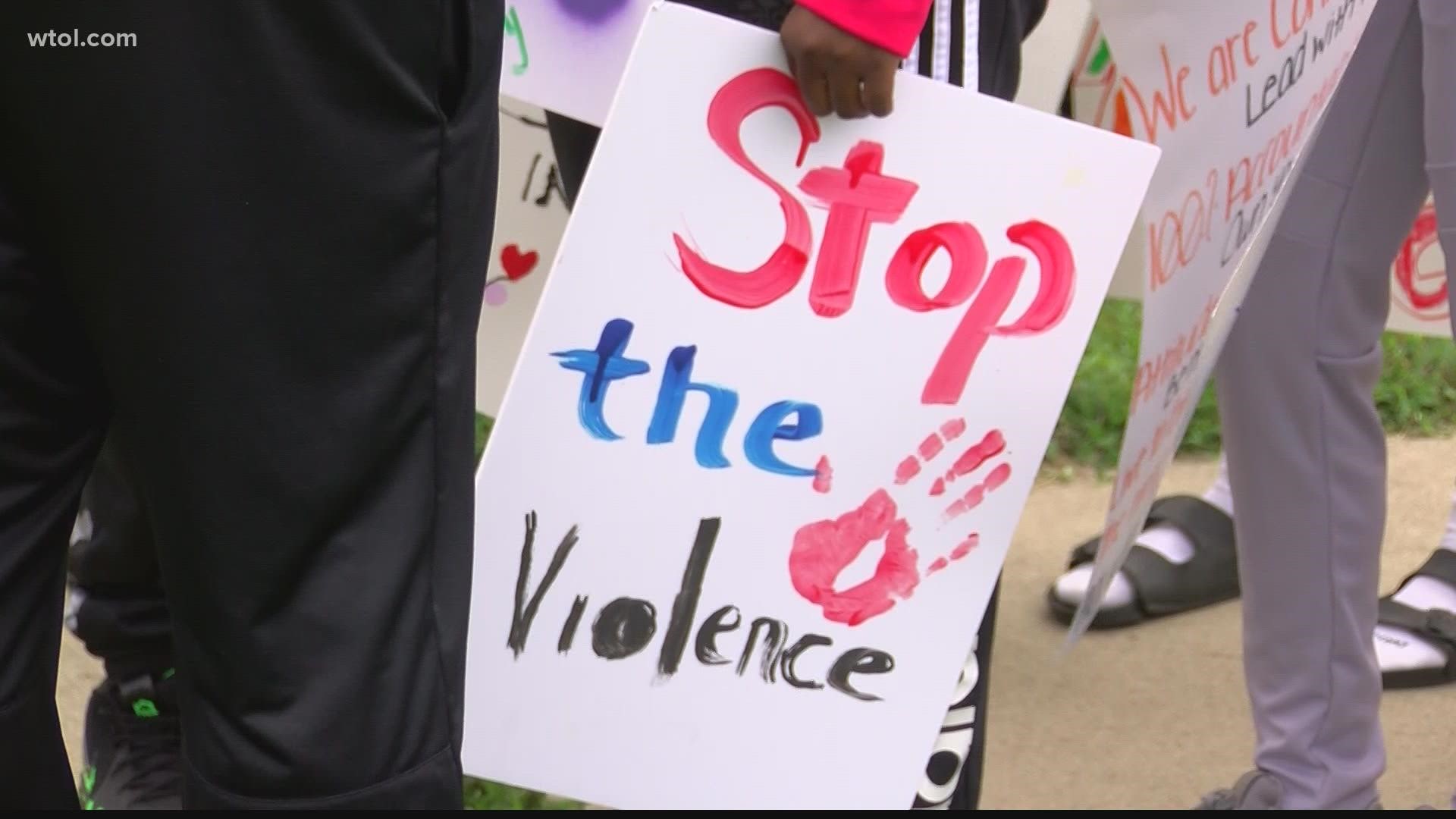 Save Our Community, along with other city groups, marched down Detroit Ave. on Saturday calling to "change the community" and stop the violence.