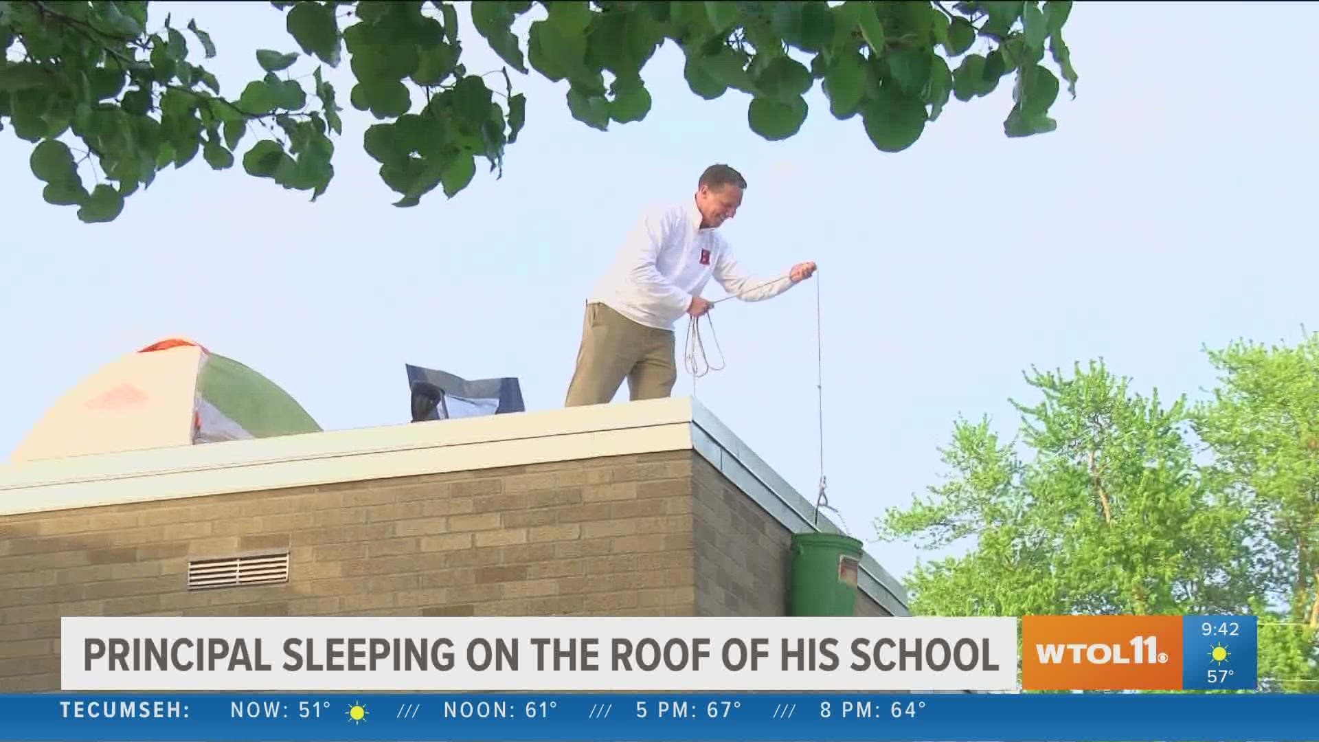 Principal Steve Swaggerty challenged his students to read 50,000 books. If they did, he said he would sleep on the school roof. Monday night he had to make good!