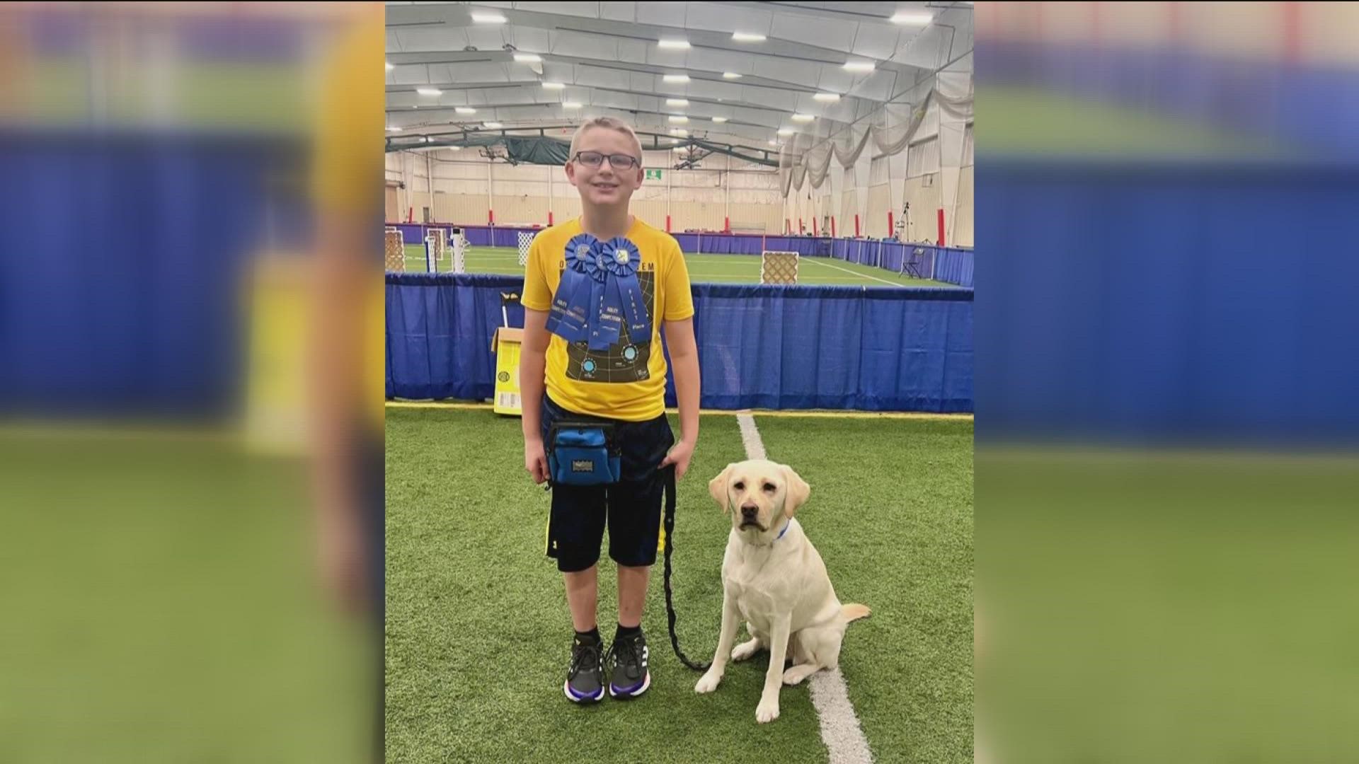 Stella, a therapy dog from Toledo's Ability Center, has been comforting 10-year-old Noah Henderson with his anxiety and sleeping issues.