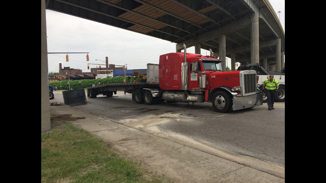 Semi hauling 45,000-pound steel coil rolls over in central Toledo ...