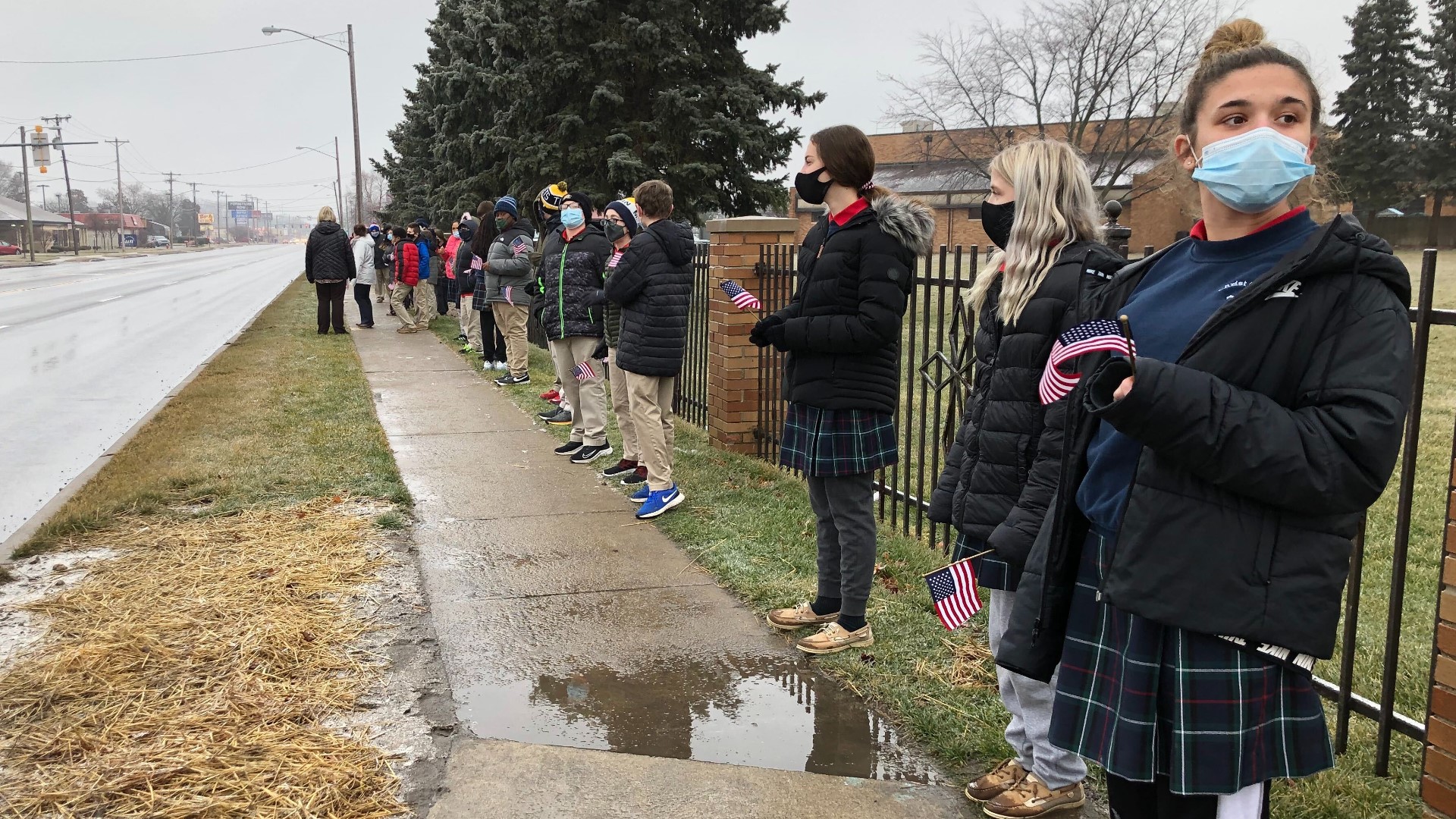 Students from Christ the King lined the procession route as Ofc. Brandon Stalker was taken to Toledo Memorial Park, his final resting place.