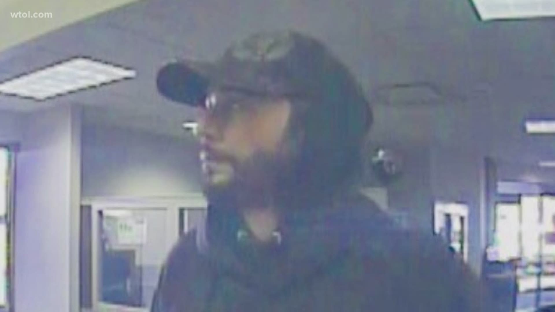 Police say the man entered Key Bank in west Toledo, demanded cash, indicated he was armed and fled after getting money.