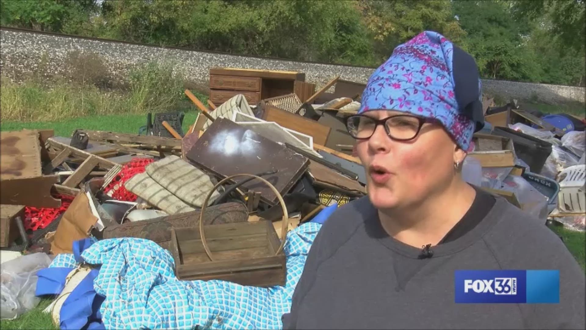 Junk, trash and other blight from a house whose residents got evicted are now sprawled along the grass in this community, leaving neighbors displeased.