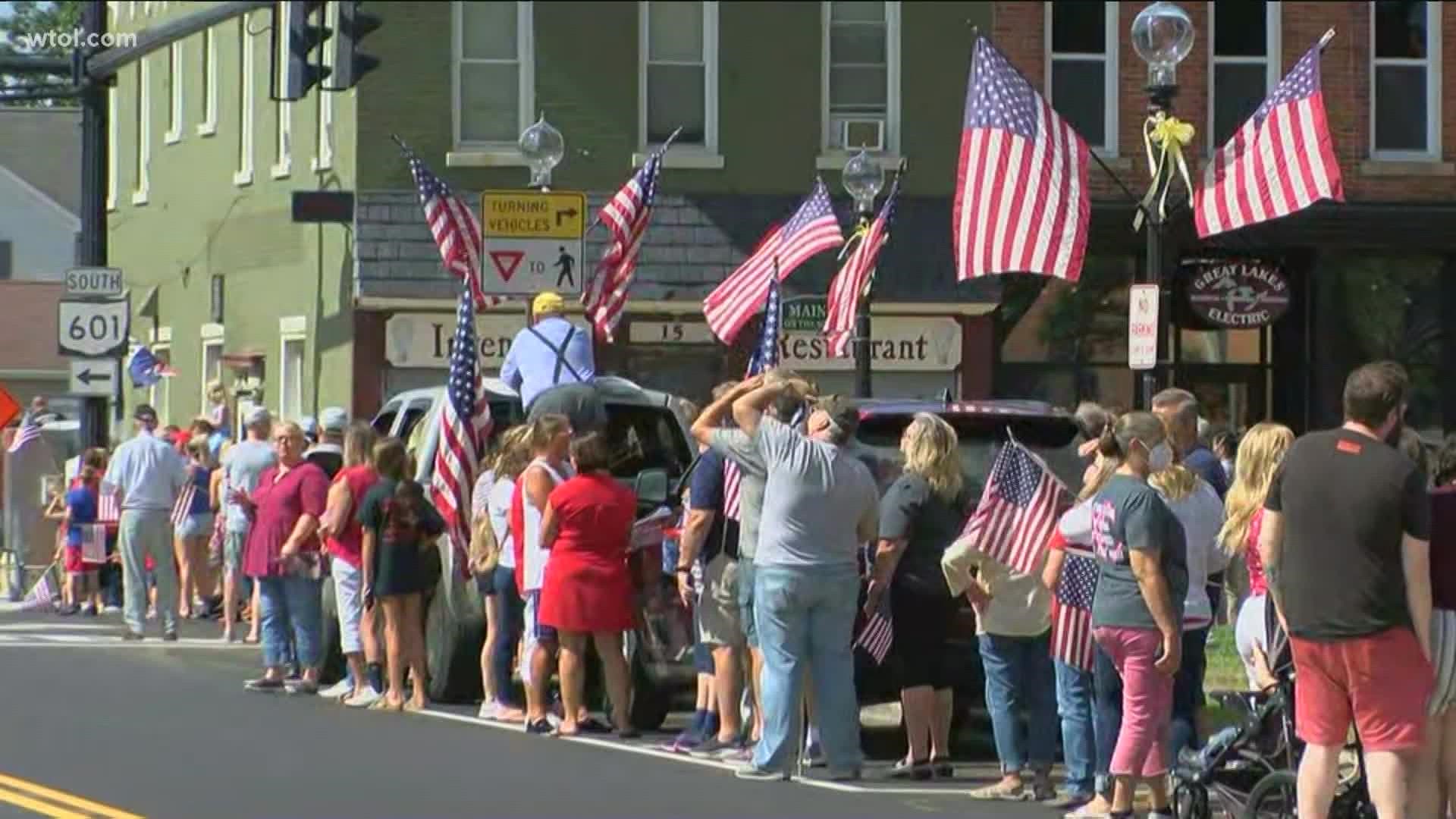 Community members lined up for hours before the procession arrived from Cleveland to Milan, Ohio. Soviak was killed in Kabul on Aug. 26.