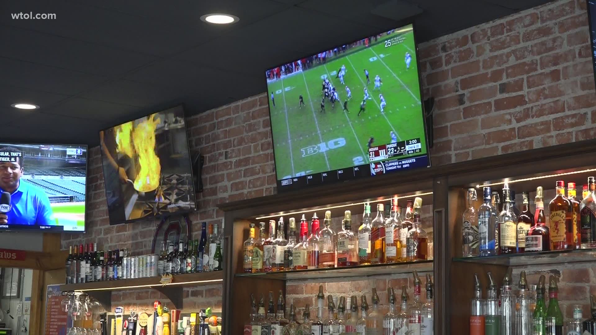 Bars would normally be packed with Ohio State fans during a big game like Monday's national championship, but the curfew continues to cut profits.