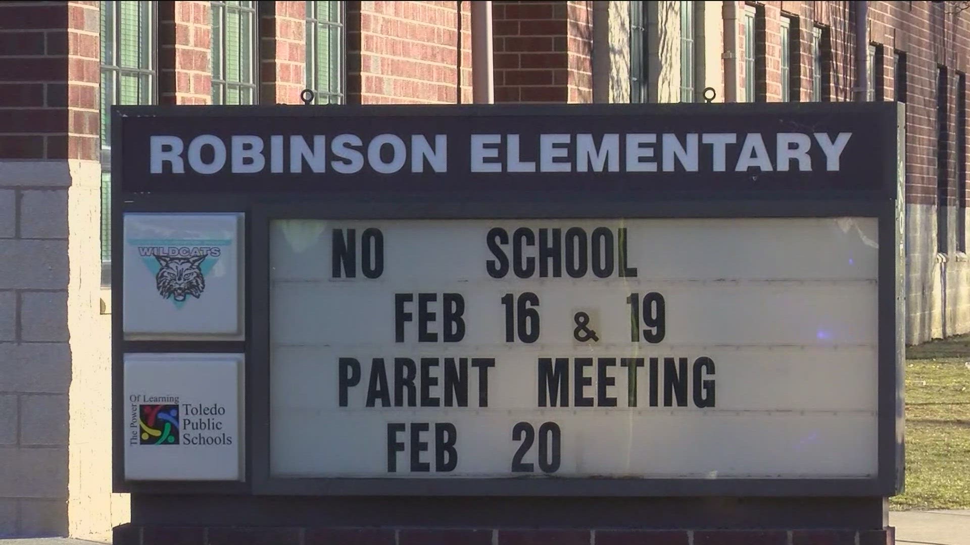 The incident began as an argument between two students at Robinson Elementary School and ended when one of the students grabbed scissors and lunged at the principal.