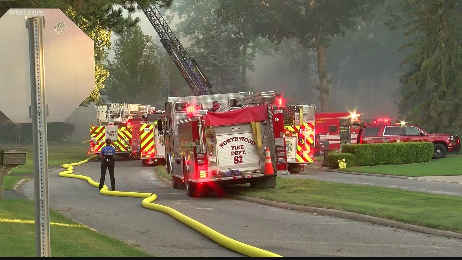 E. River Road and Secor Woods Lane was closed as firefighters contained a house fire in the 100 block of Secor Woods.