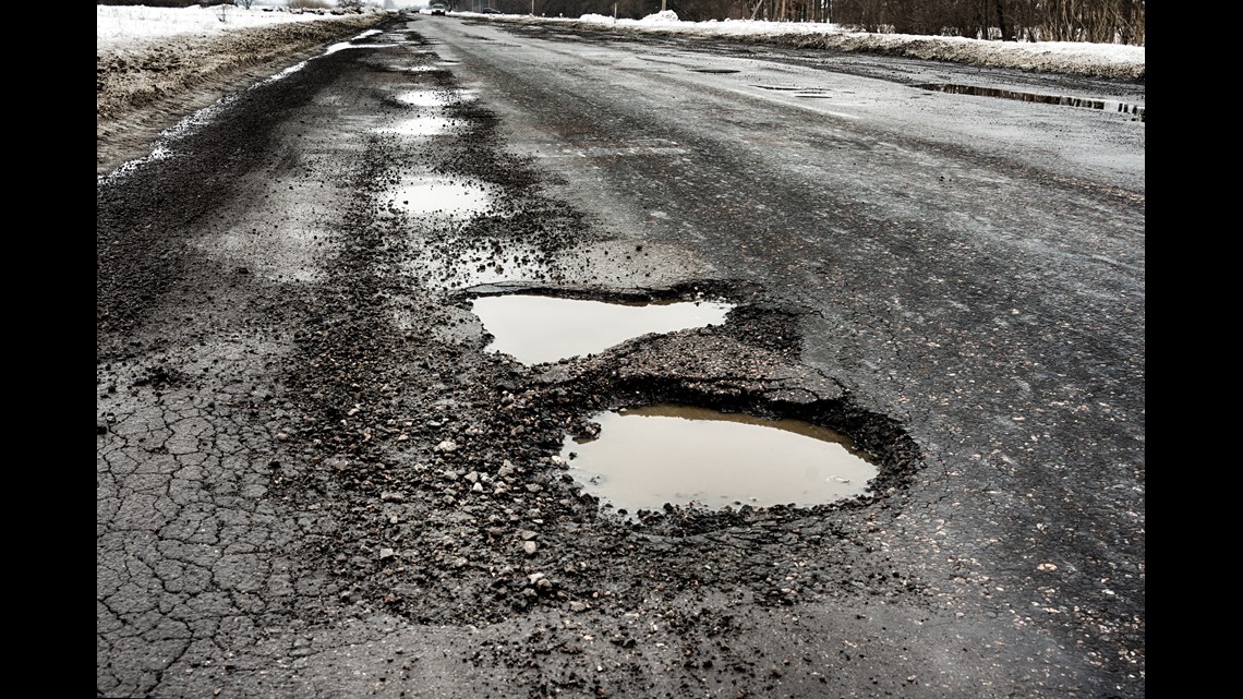 Fixing ‘the damn roads’ himself Boy filling potholes in Michigan