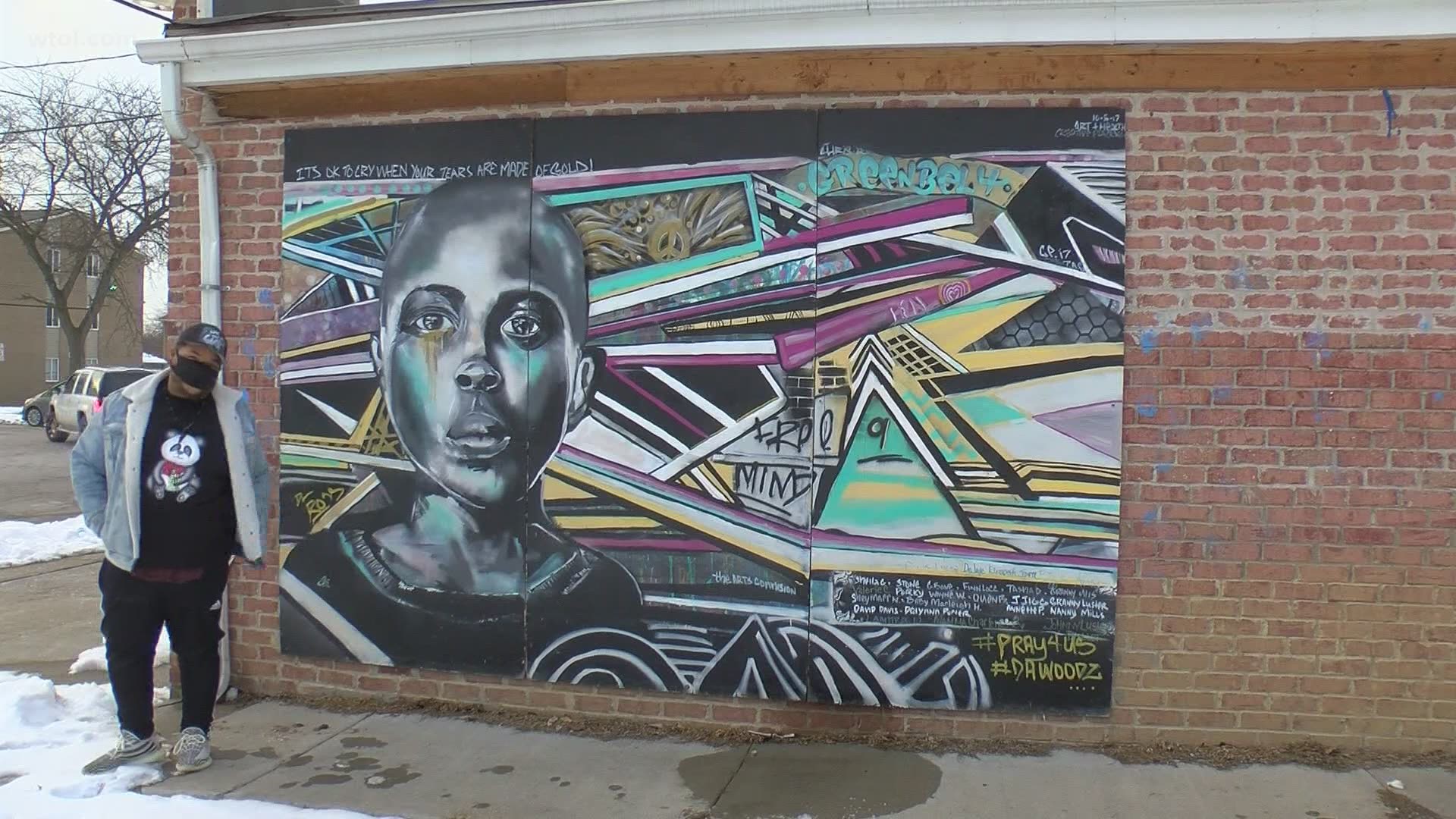 David Ross works with the Arts Commission, but is also known for painting or helping to coordinate some of the most memorable murals across Toledo.