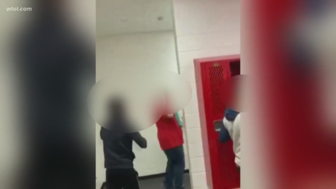 Rogers High School principal says the student who threw the punches in a video that went viral is suspended pending a meeting with a dispute hearing officer.