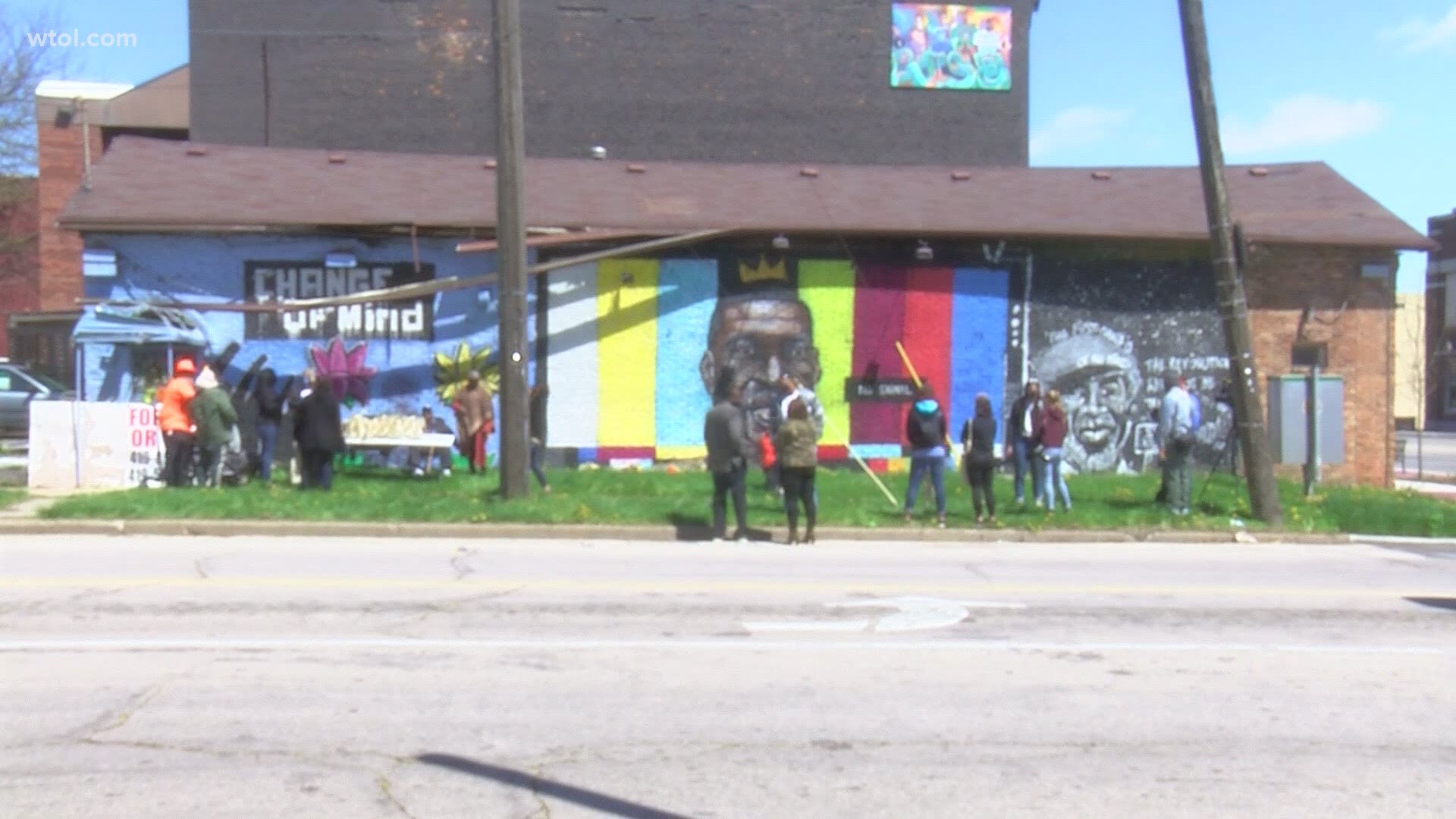 People gathered at the George Floyd street mural in north Toledo to honor him and talk about where the movement for police accountability and reform goes from here.