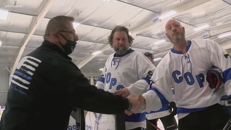 Police face off in charity hockey game with a goal of honoring fallen officers and protecting others