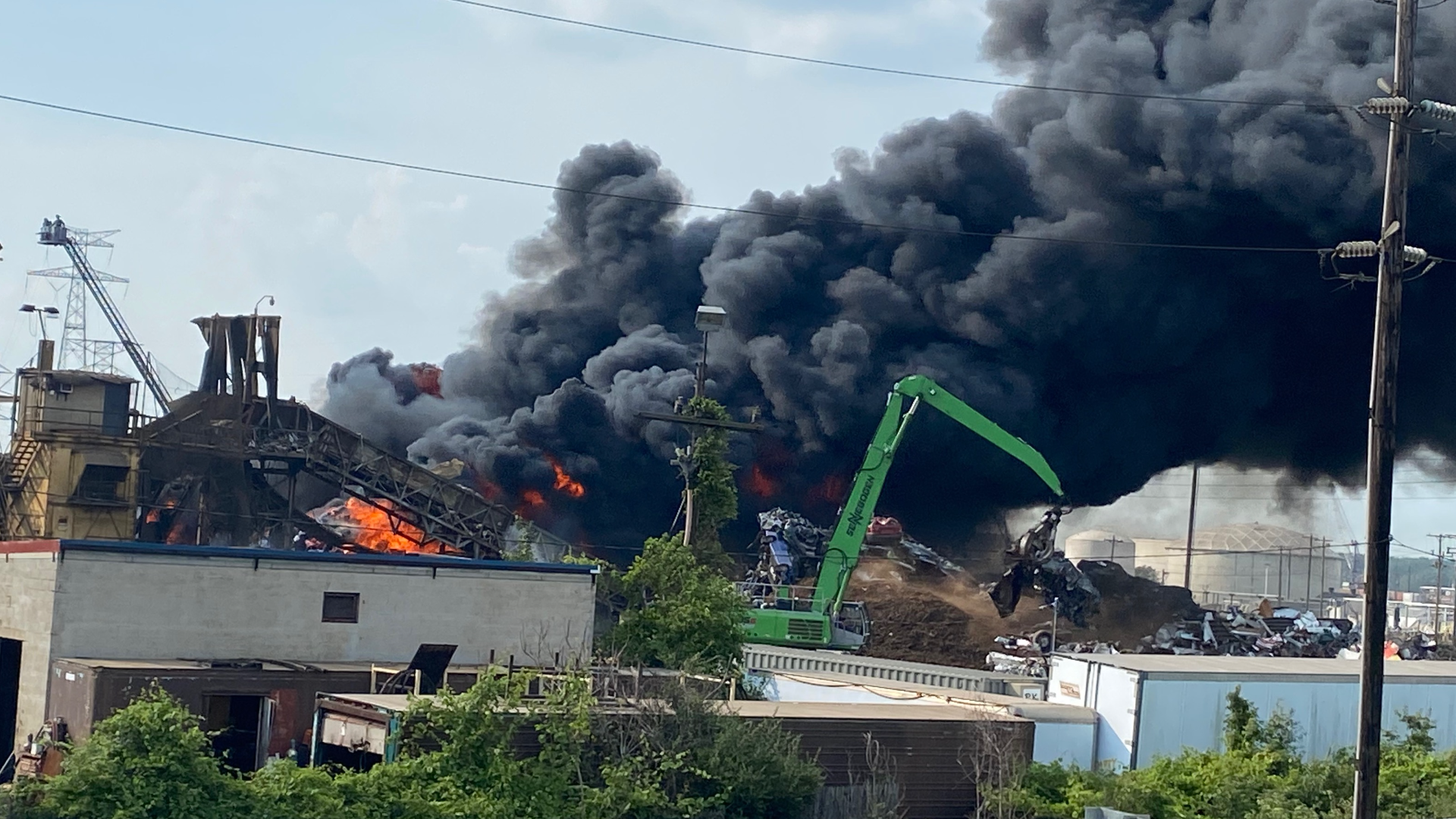 A large area of shredded cars and scrap metal is burning, according to TFRD. Environmental services and EPA are on scene as crews begin to get flames under control.