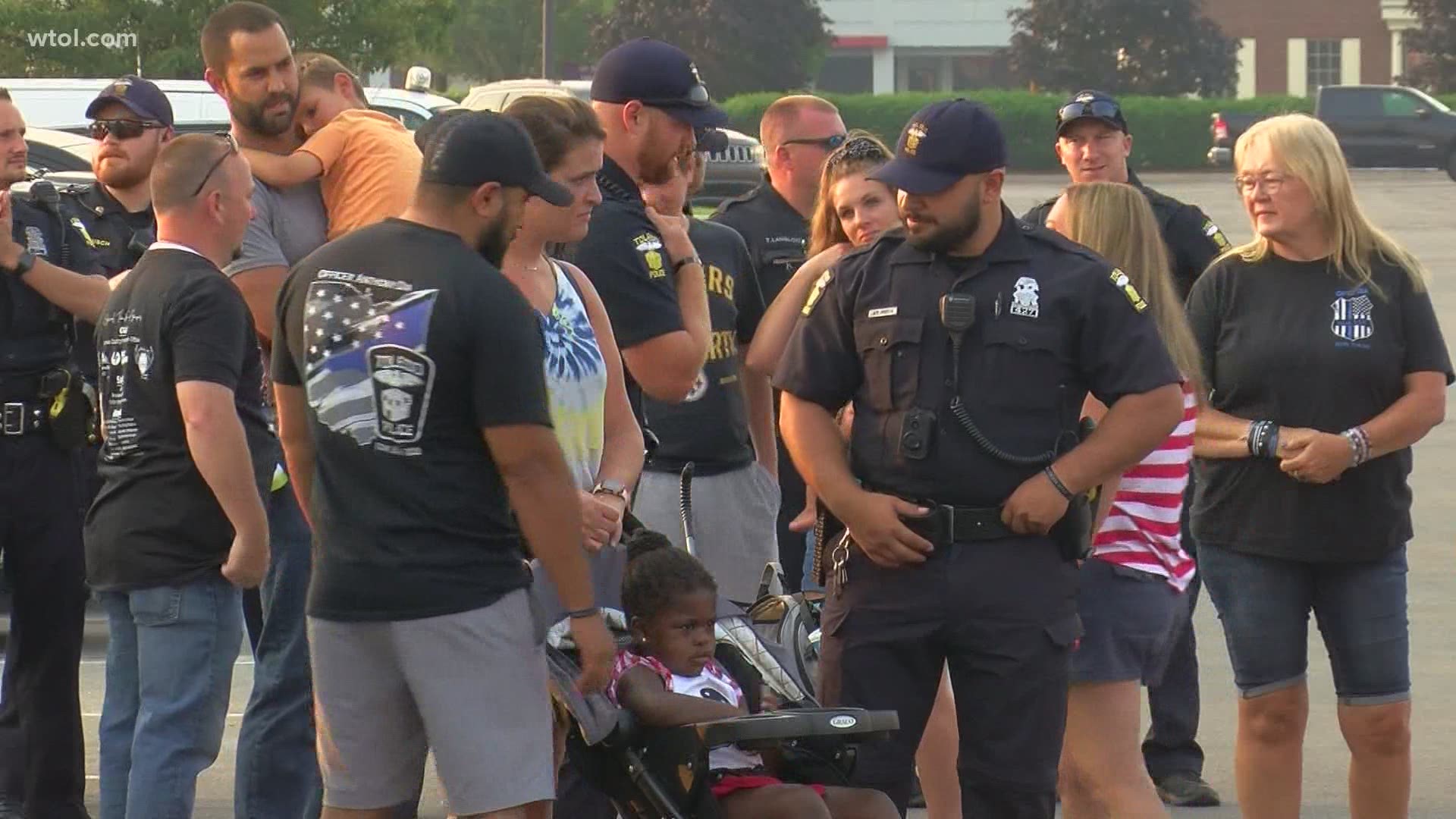 On Sunday, a large group of people gathered at the Home Depot off Alexis Road where Officer Dia responded to his last call.