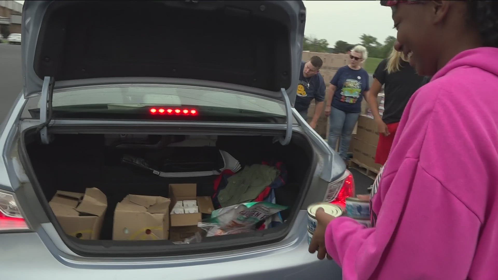 High school student-athletes from across Seneca County volunteered to help hand out food to those in need Monday.