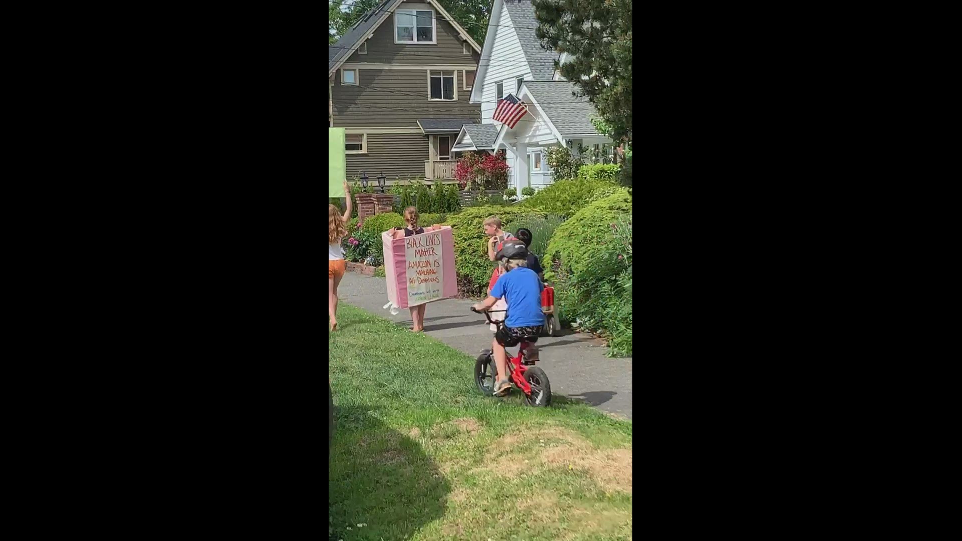 Kids walk through neighborhood chanting Black Lives Matter.