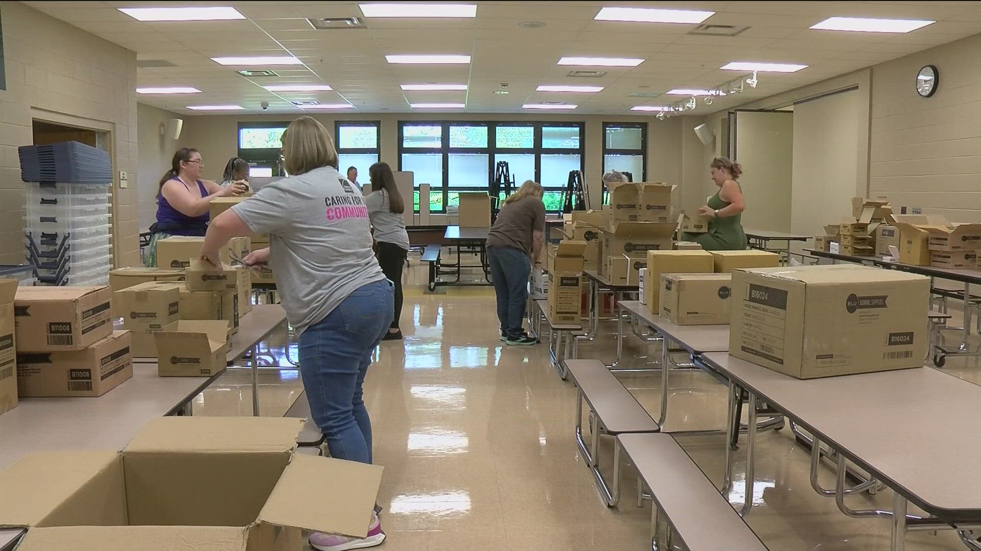 Volunteers from Owens Corning packed nearly 300 backpacks full of school supplies including pencils, notebooks and other art supplies for the students.