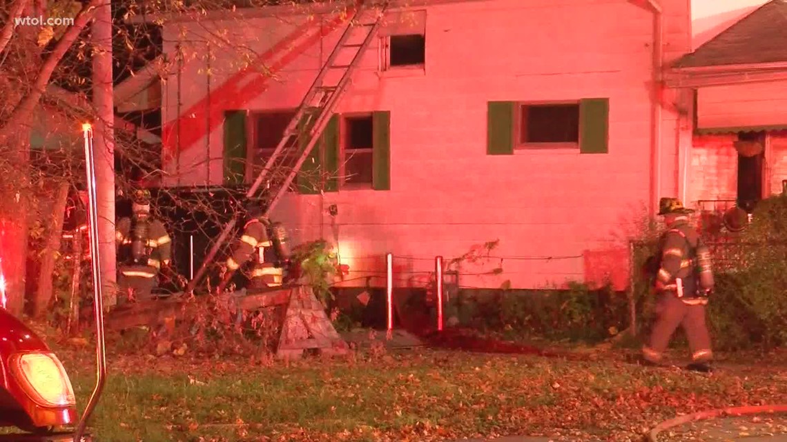 Toledo firefighters battle smoke and flames at central toledo home