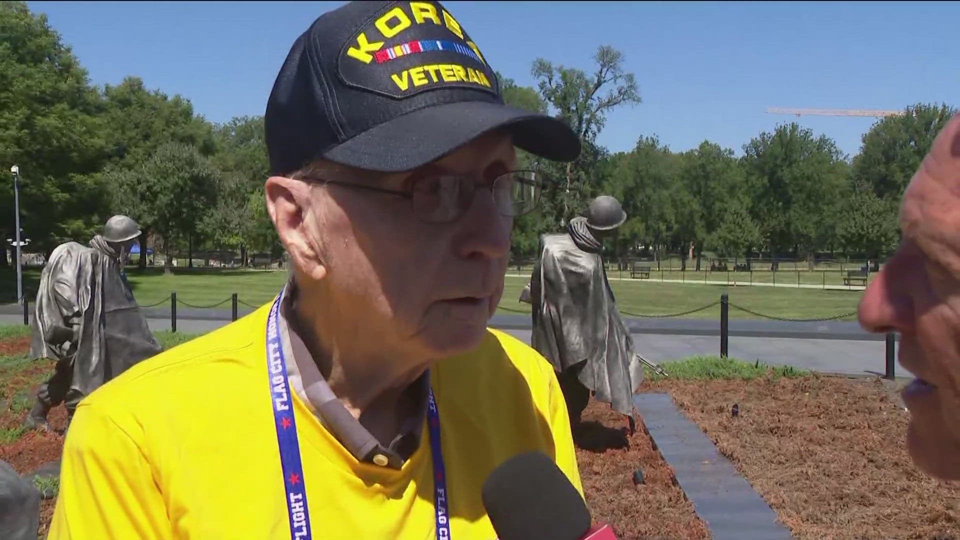 Korean War veteran Ralph Burbridge from Erie, Michigan, and his daughter Dee Kaczynski visited the Korean War Memorial during Flag City Honor Flight.