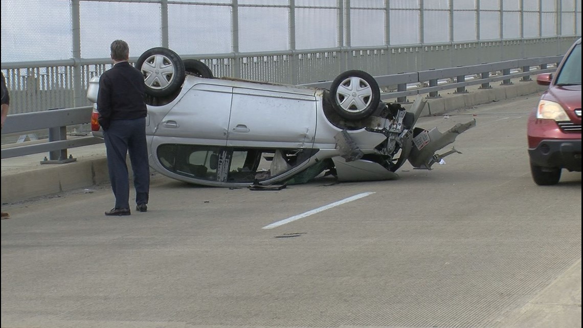 Car flips over on High Level Bridge