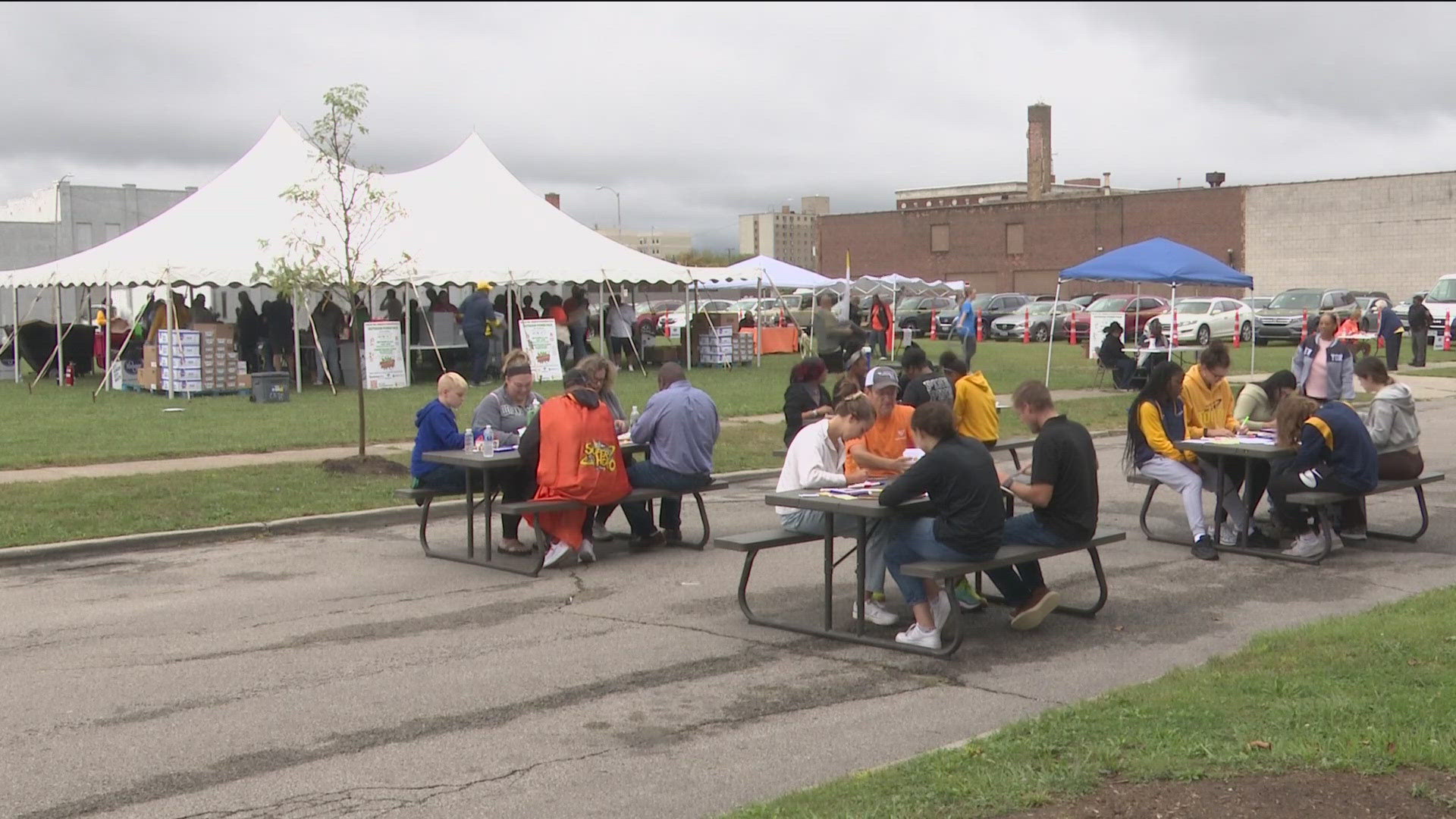 Connecting Kids To Meals in downtown Toledo hosted an outdoor meal packing event. Volunteers put together 3,000 "weekend bags" with snacks and drinks for kids.