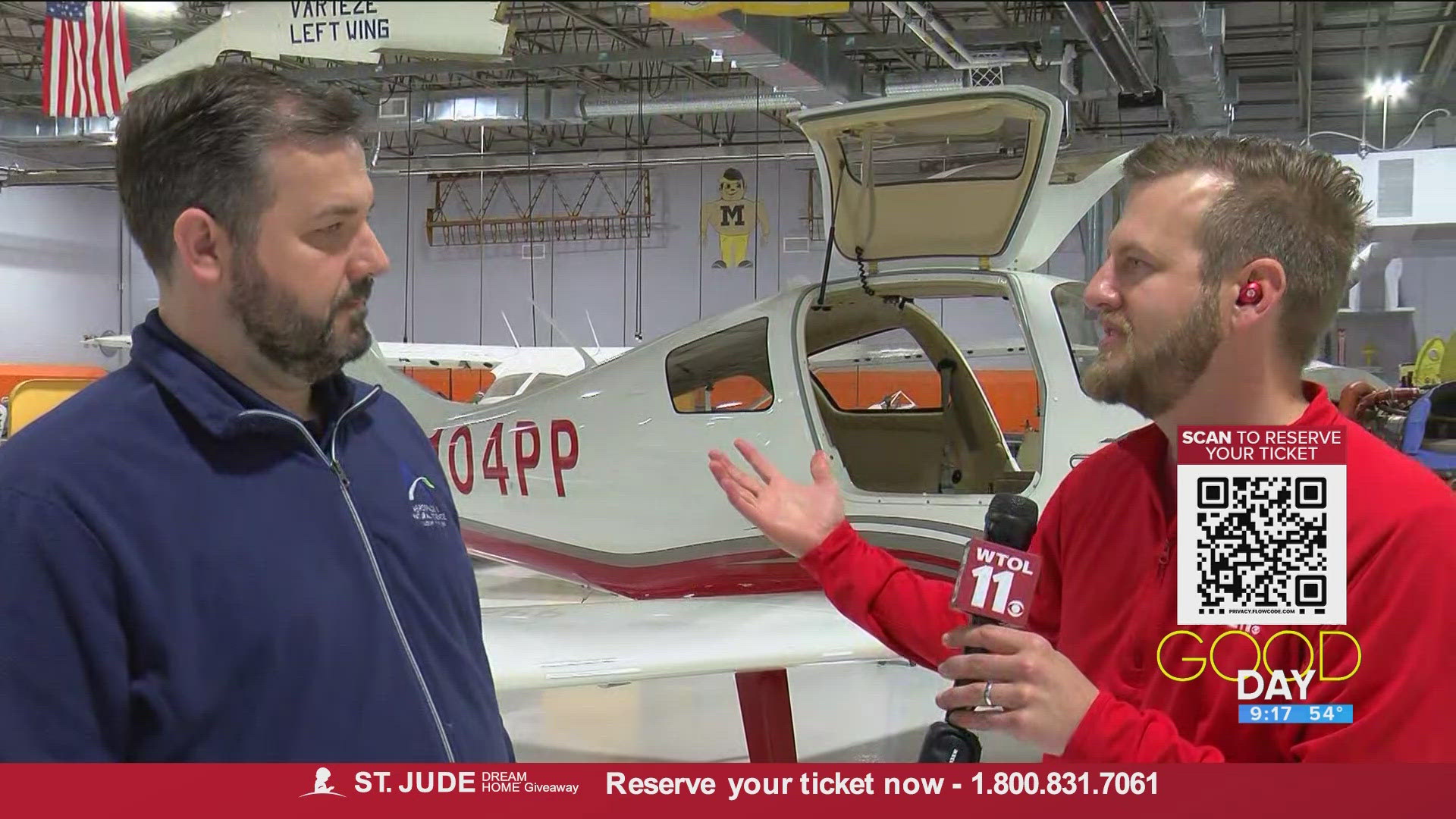 Instructor Kurt Wicklund at the Aerospace & Natural Science Academy of Toledo at Eugene F Kranz Toledo Express Airport talks the facility's open house.