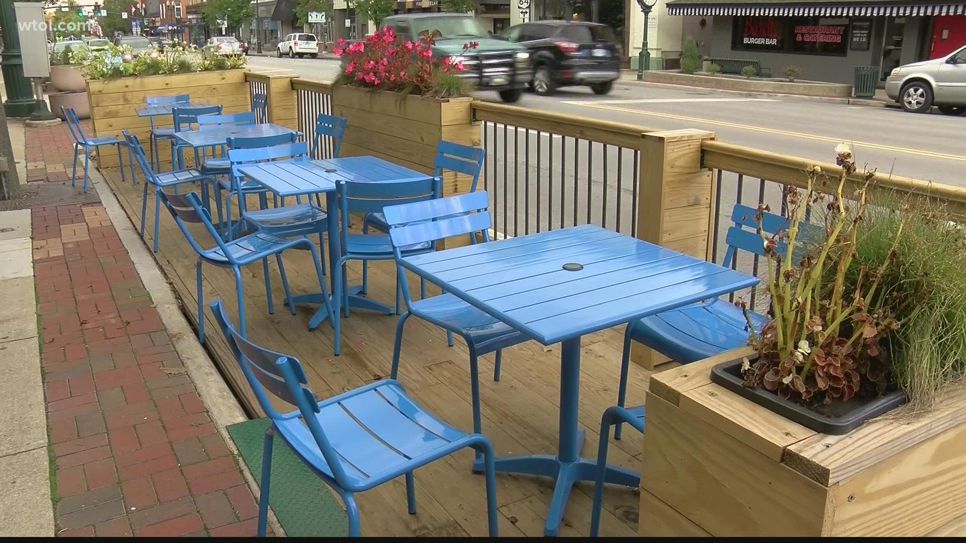 The outdoor dining decks parked outside three downtown Bowling Green businesses will now stay up until December 1.