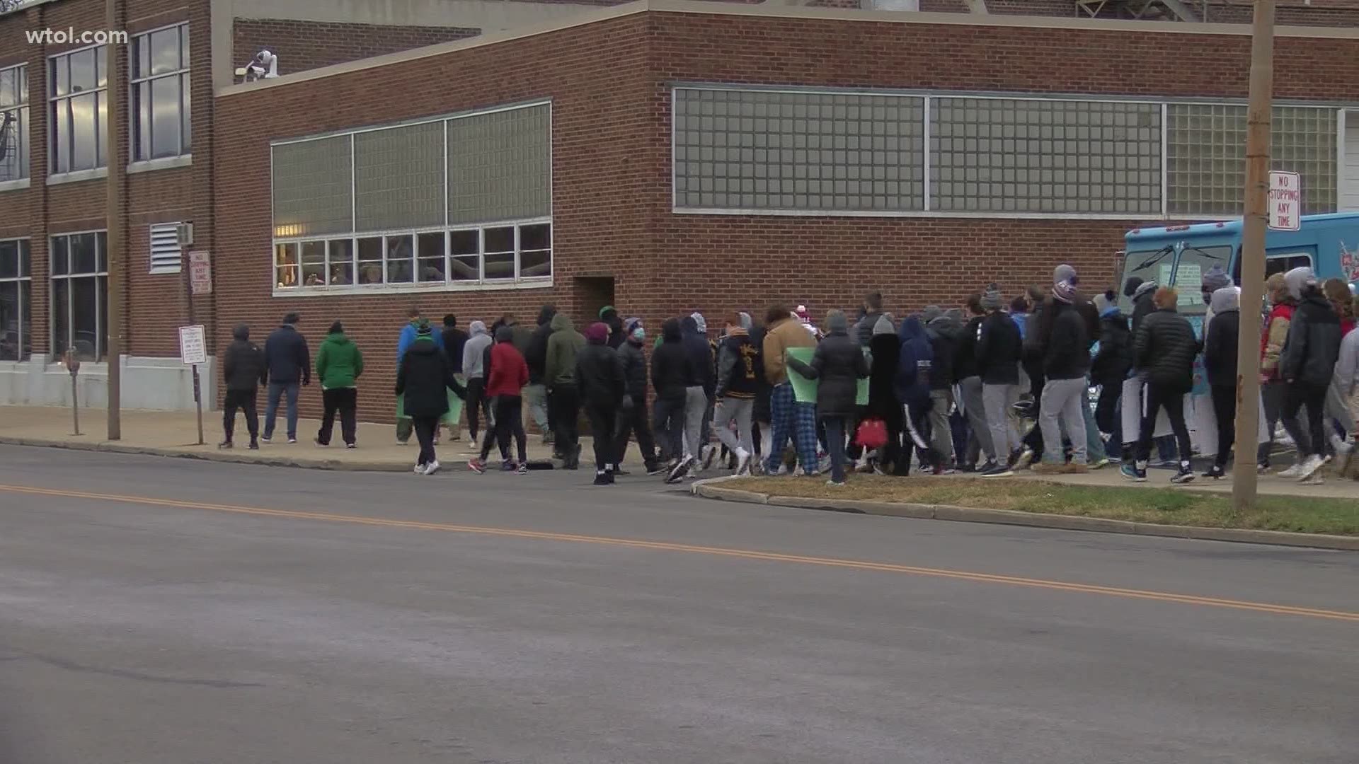 A group of protesters are marching in downtown Toledo trying to get the attention of the Lucas County Health Department