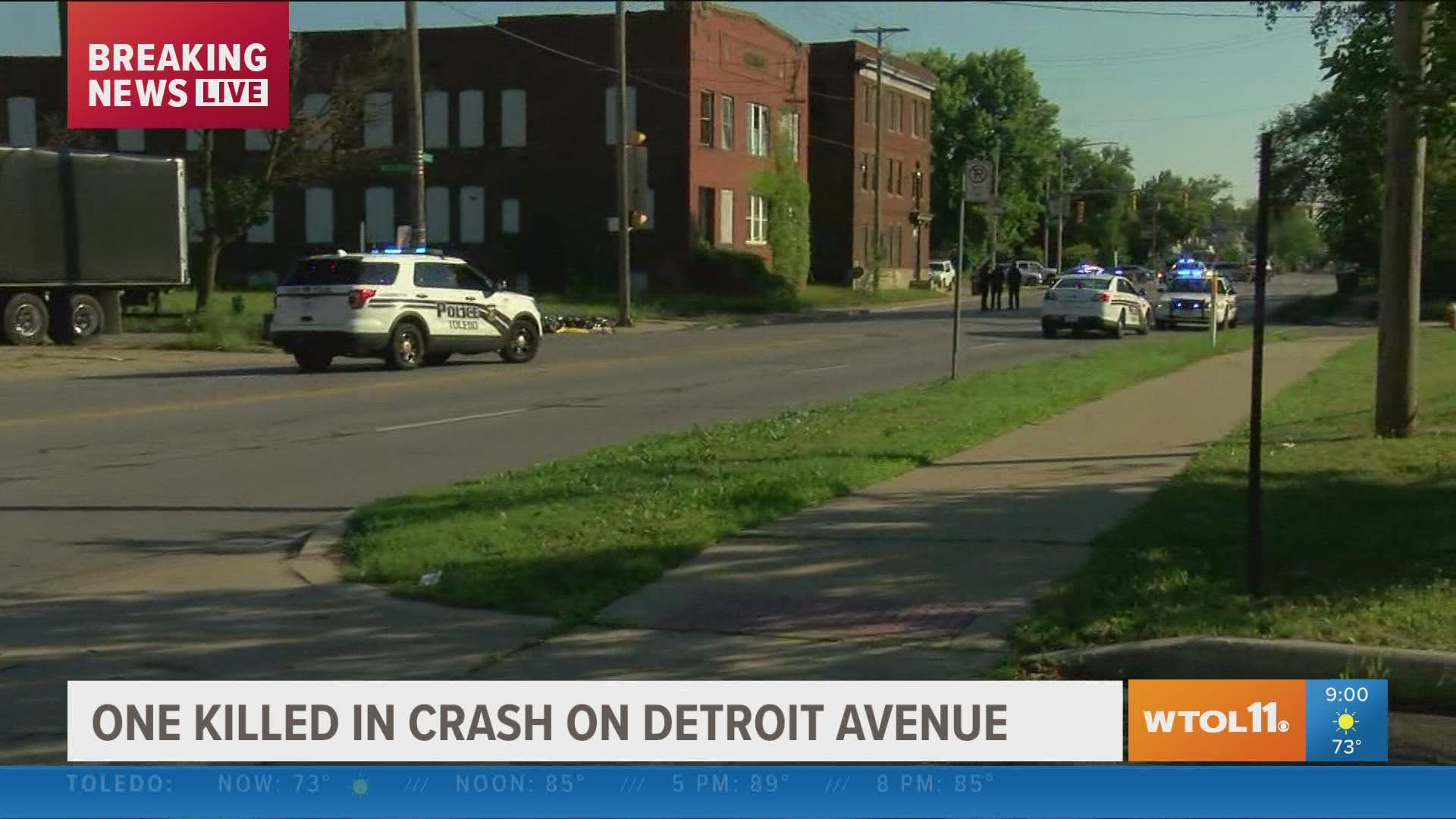 Motorcyclist was involved, police are questioning person in commercial truck at road closure.