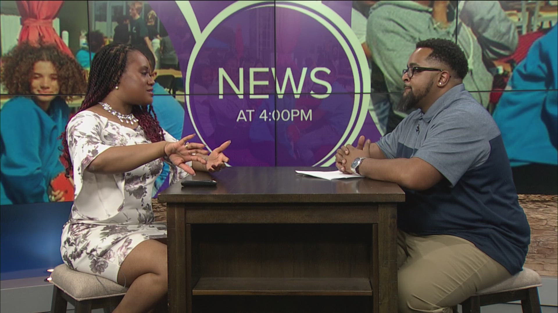 Walter Johnson with the west Toledo YMCA talks with TaTiana Cash about the program and how people can take part.