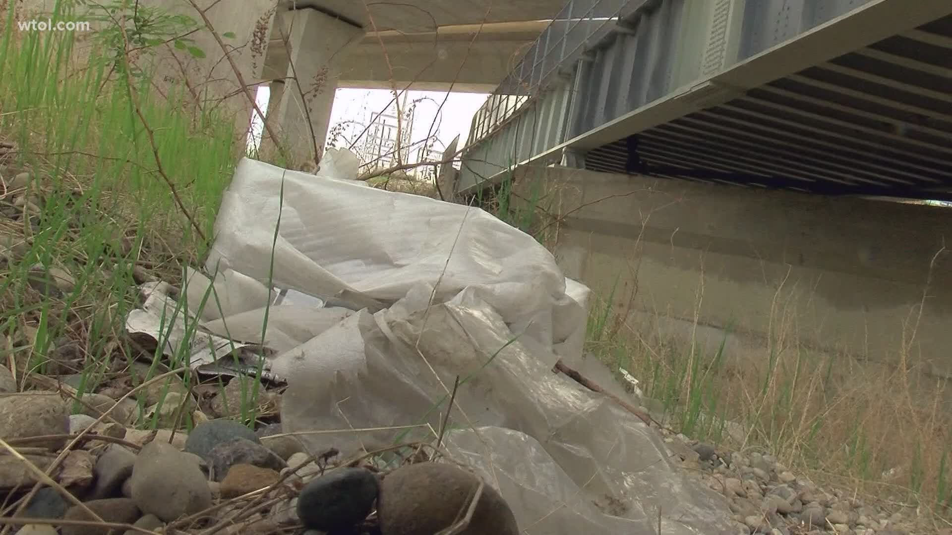 Central Toledo residents are worried about cleaning it themselves due to safety hazards, including the possibility of needles hidden in the debris.