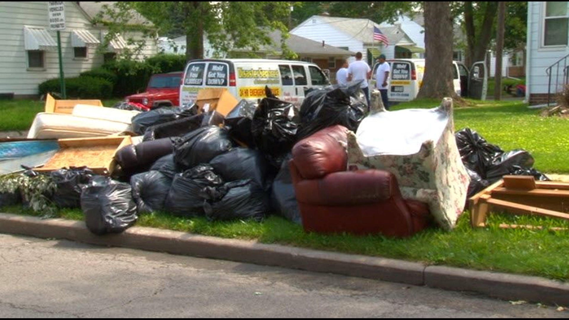 Police: Scavenging Flood Victims' Trash Is Illegal 